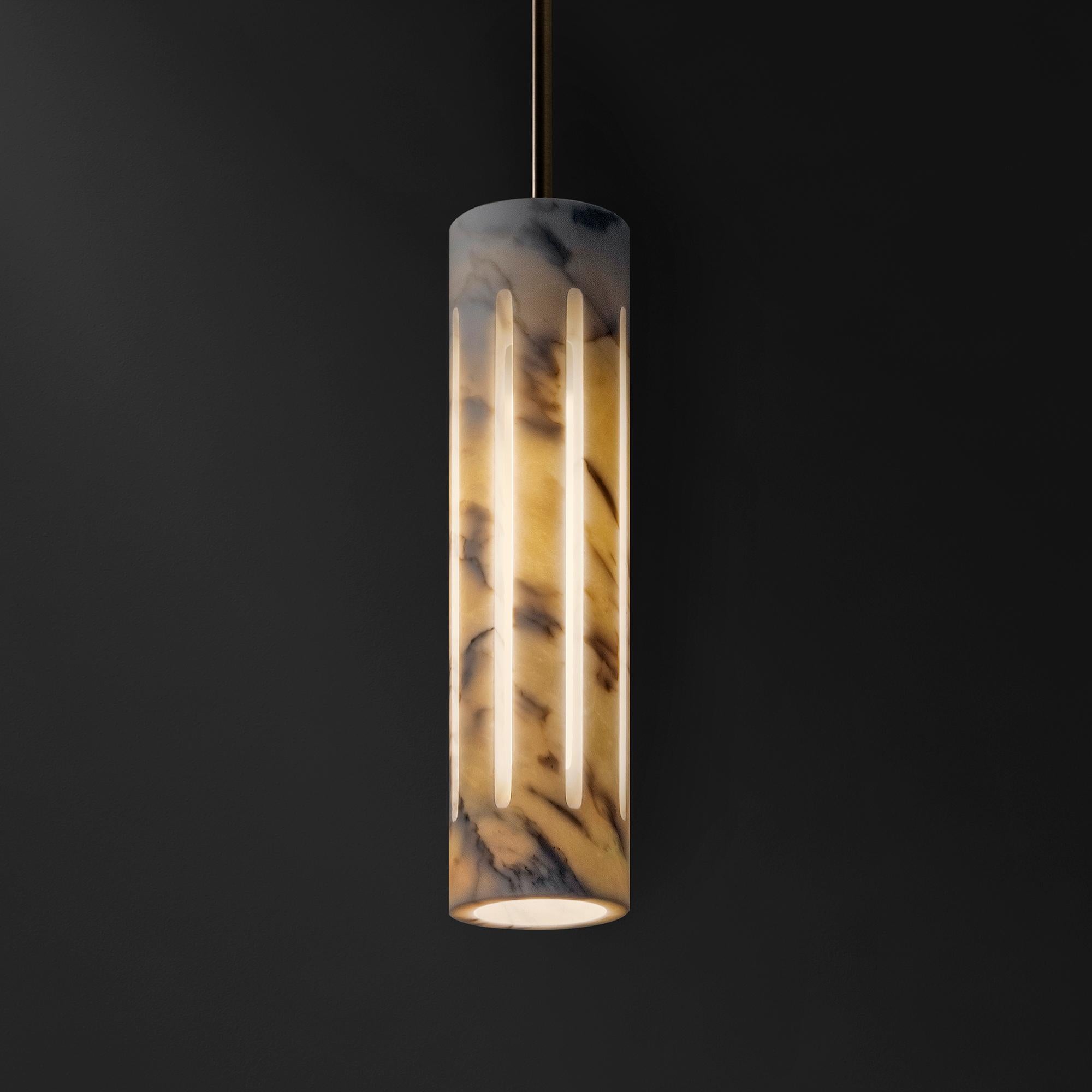 Aura is a contemporary reinterpretation of the ancient outdoor lantern.
Masterfully carved from a single block of Calacata Borghini marble, Aura is both a lighting fixture and a sculpture. Vertical cuts on the cylindrical surface allow light to