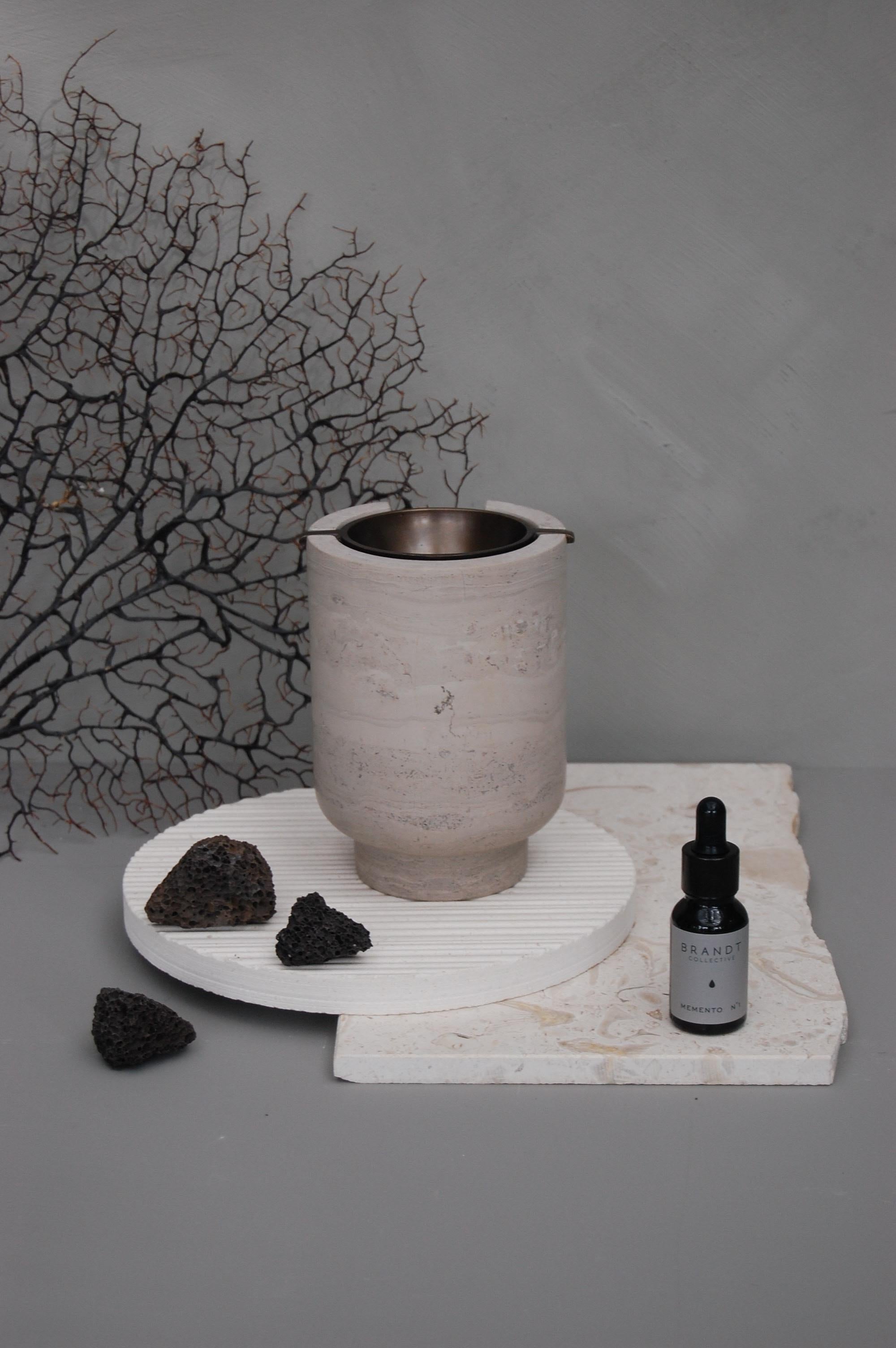 AURA Oil Burner in Chalk Grey is a beautiful diffuser made of natural marble and here with a burnished brass bowl. AURA Oil Burner is not only an aesthetic object, but it also creates an atmosphere with our scented, ambient aromatherapy oils. AURA