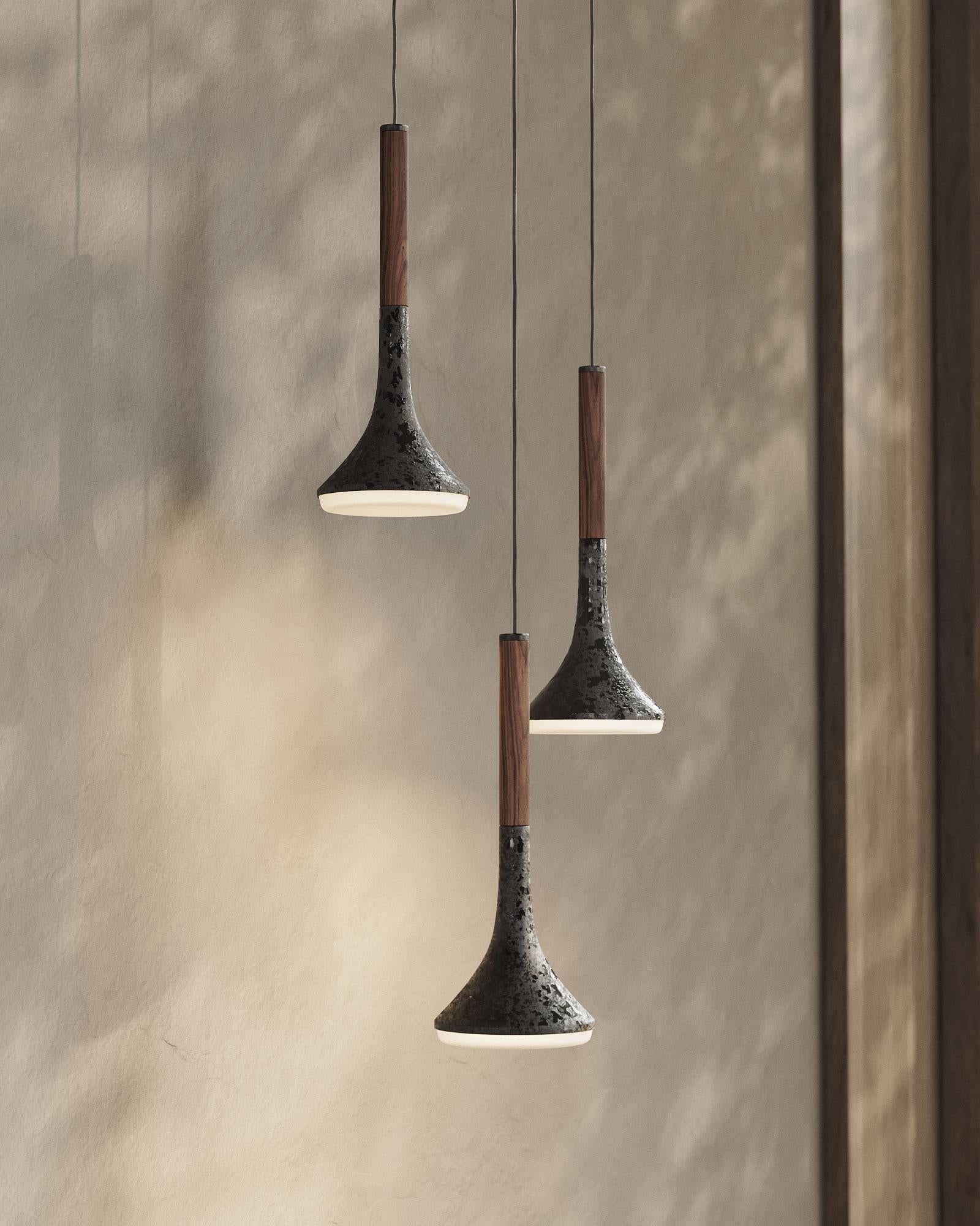 AURA is the result of experimenting with porcelain enamel on raw steel, today known as Pewter. The imperfect application of the vitreous enamel on the conical shape of this lamp makes each piece unique.

Iluminant: Incl. 5 W G9 LED 275 lm, 120 V ~