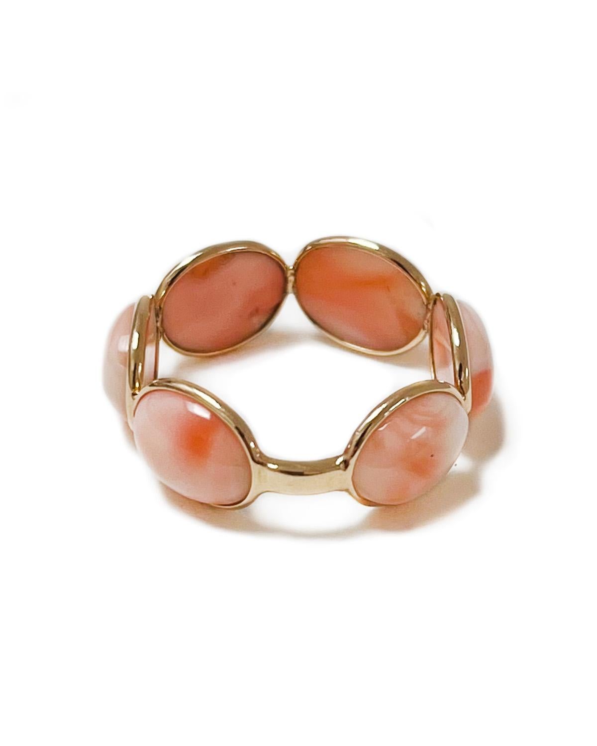 Intention: Stack it on

Dorian's Find: This vintage find is a peachy love. Here, large oval cabochon coral is in an 18k yellow gold spectacle setting to show off the full gemstone. You could spend hours gazing at the variations in color of each