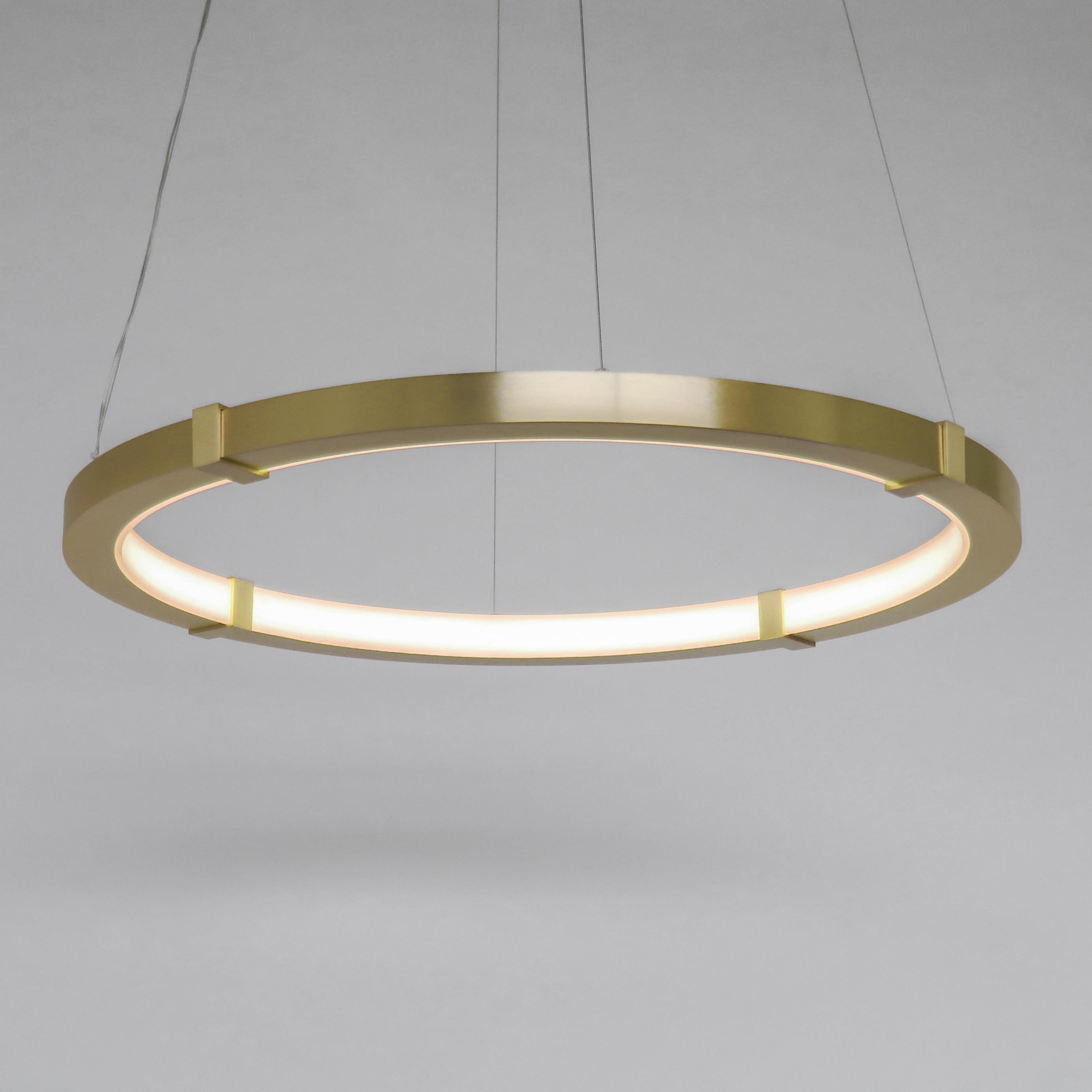 The Aura Slim pendant emits an elegant glow that is diffused by a minimal satin white acrylic inner ring. The outer ring is composed of cold-rolled steel and can be finished in plated or powder coat options. The Aura Slim Pendant works beautifully
