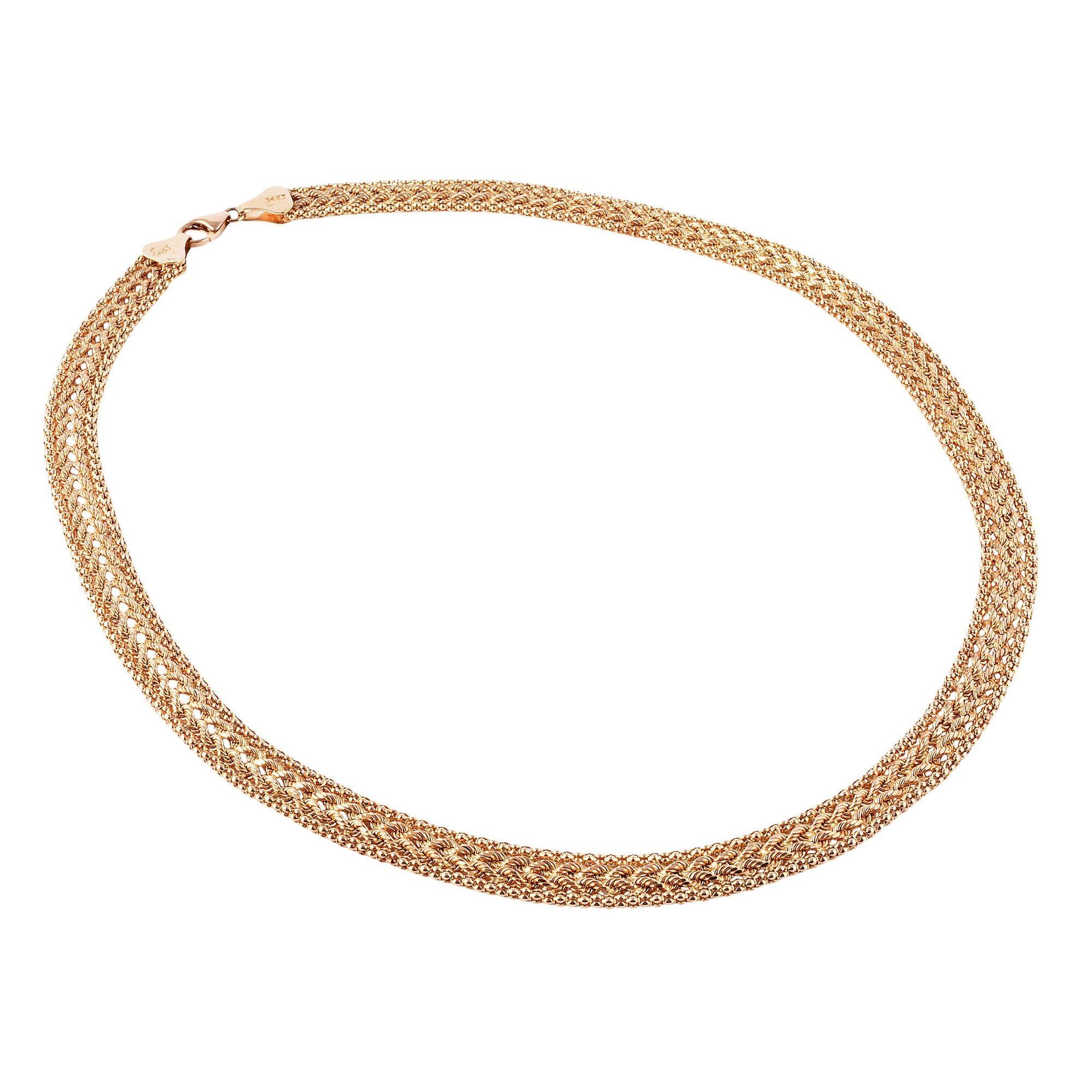 Estate Peruvian Aurafin woven gold necklace. This woven necklace is crafted in 14 karat yellow gold with a rope design center and a row of popcorn chain on each side. The yellow gold necklace is secured with a lobster clasp, weighs 12.5 grams, and