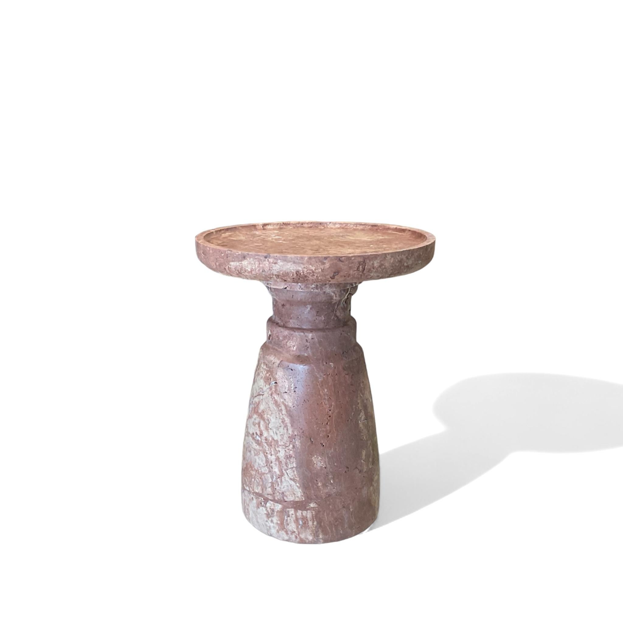 ‘Aurea’ Side Table by HAAND, crafted from premium red natural travertine stone. This exquisite piece measures 13.8 inches in diameter and 18.5 inches in height, with a substantial weight of 80 lbs.

The Aurea Side Table is a testament to superior