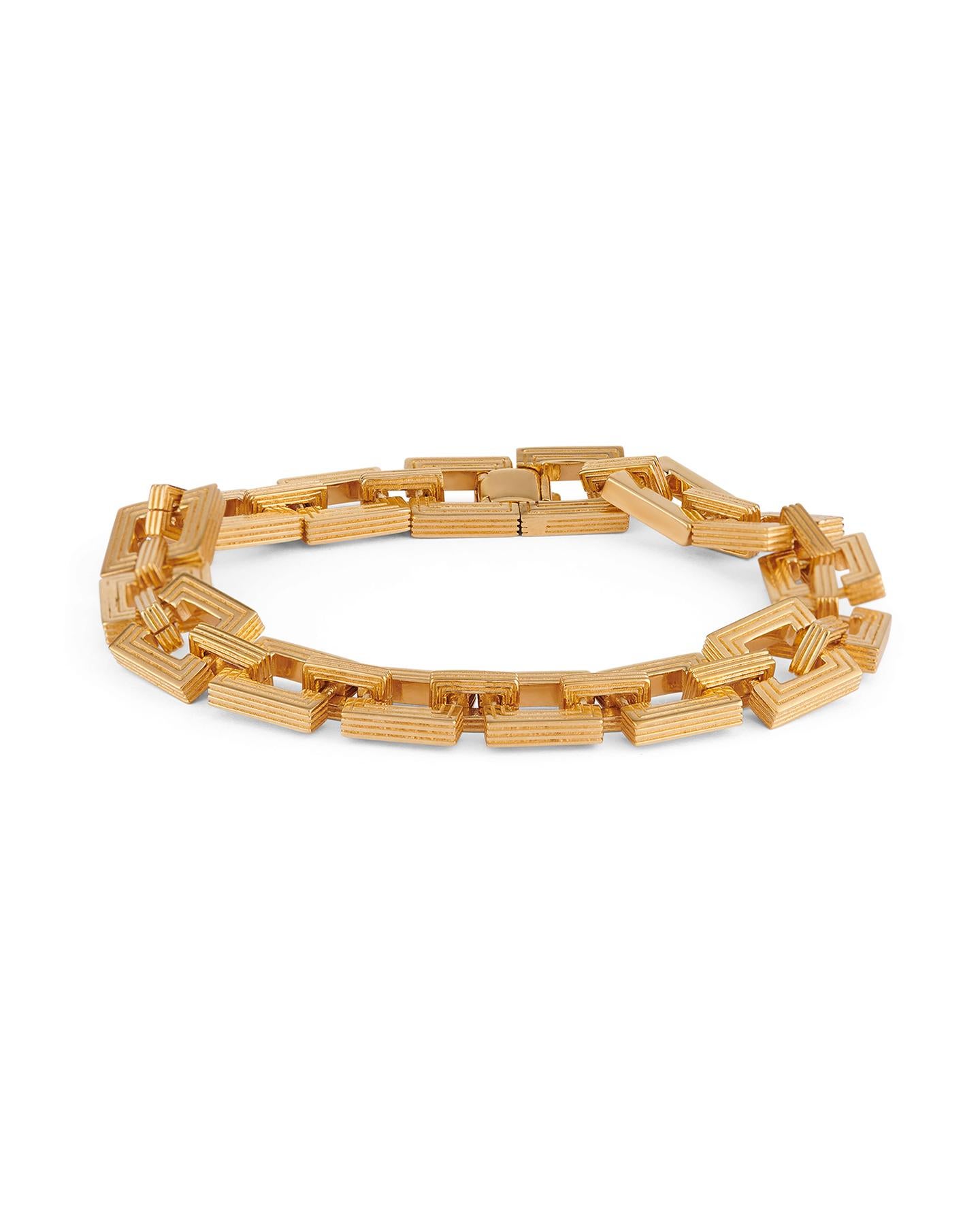 The gold-plated Aurelia Chain bracelet is made up of interlocking square links – each one is expertly crafted for a solid, notably durable feel when worn. Its striking, geometric profile nods to vintage jewelry.

925 Sterling Silver
Plated in 18K