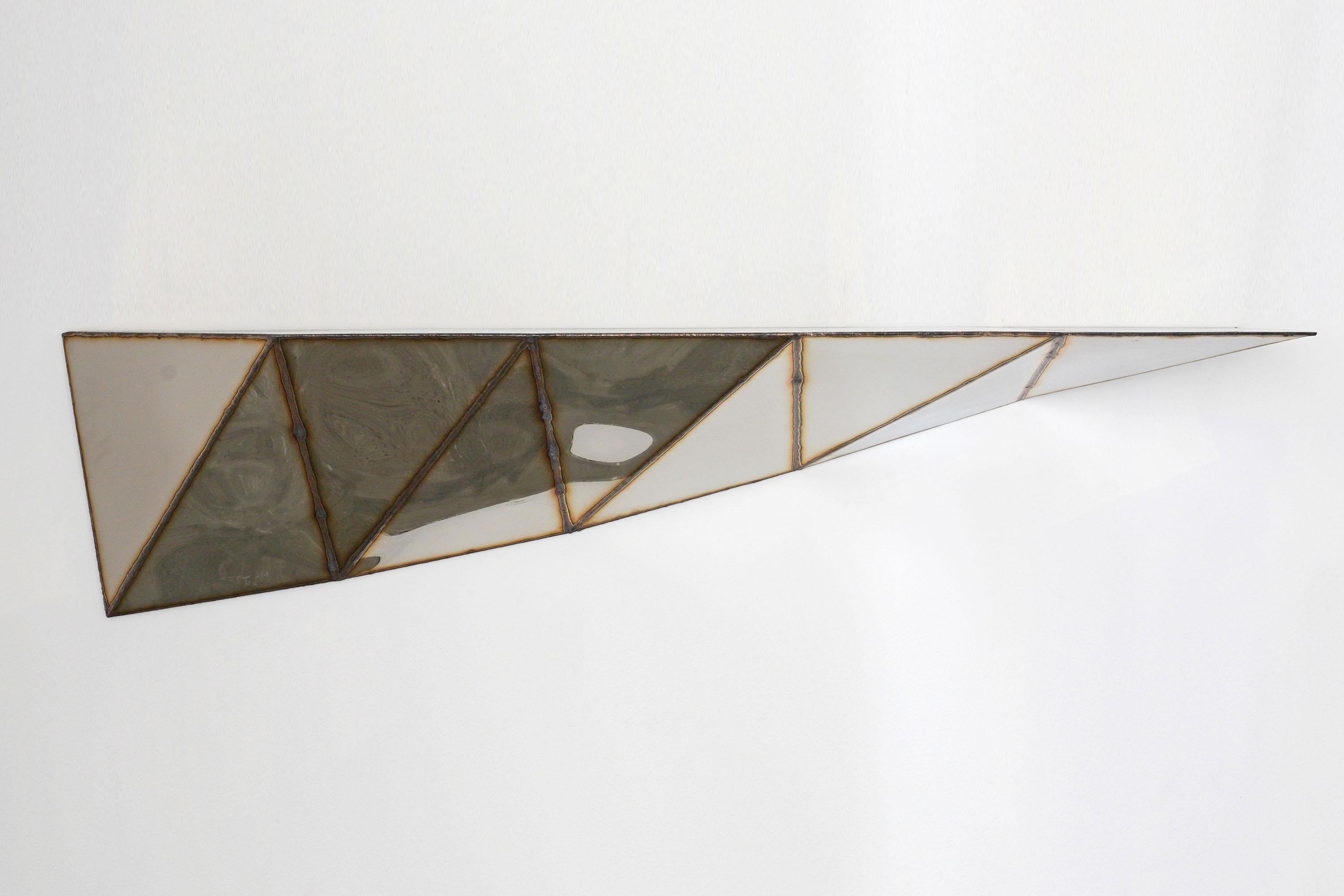 Aurelia Shelf in Welded Mirror-Polished Stainless Steel by Julian Mayor
Limited Edition of 8 + 4AP.
Dimensions: D 34 x W 142 x H 27 cm. 
Materials: Mirror-polished stainless steel.

Julian Mayor is a British artist and designer renowned for his