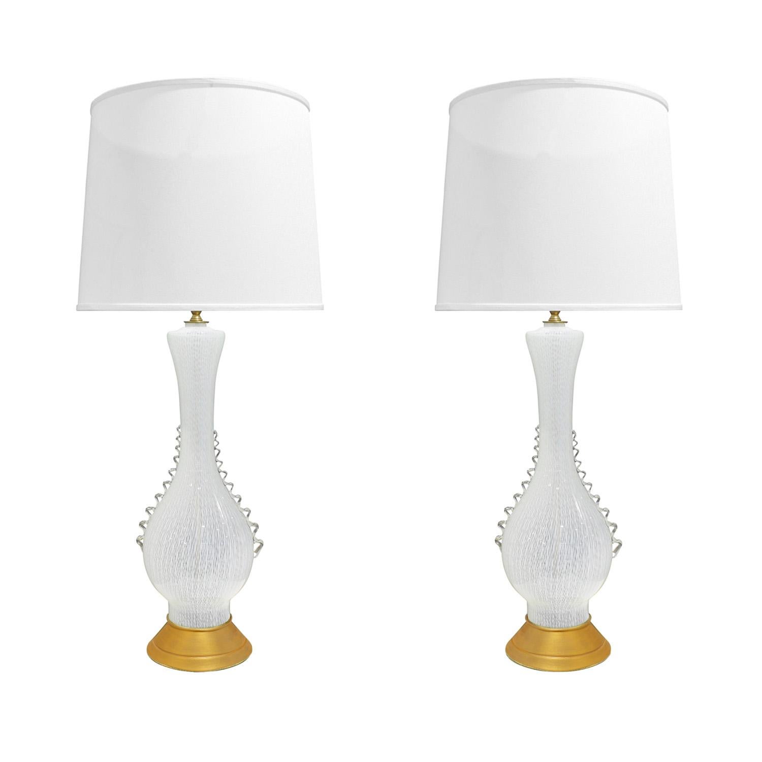 Pair of exquisite hand-blown latticino table lamps with gilded metal bases by Aureliano Toso, Murano Italy, 1950's.  The artisanship of these lamps is off the charts. Simply stunning.