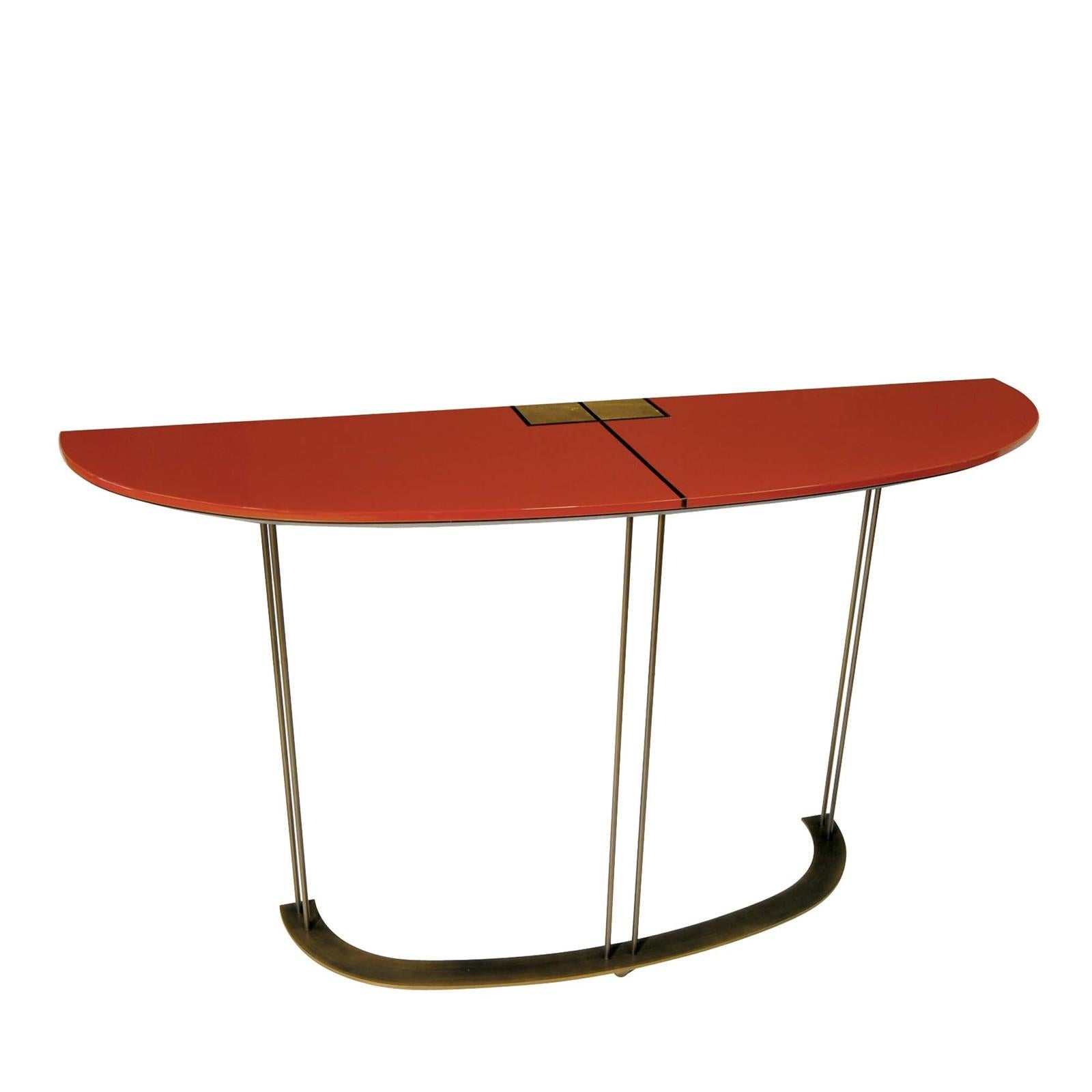 Bold in its simplicity, this modern console is defined by aesthetic versatility and structural lightness. The piece boasts a demilune profile, comprising a wooden top finished in a bright-red shiny polyurethane lacquer supported by the three tall