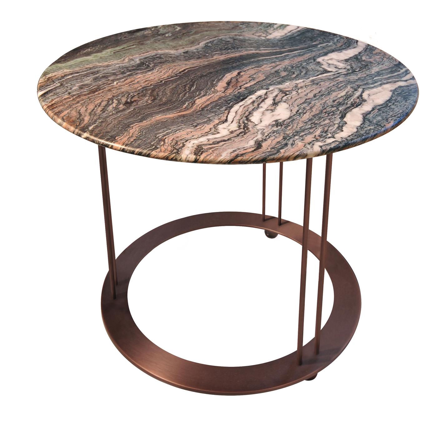 A mesmerizing combination of elegant, warm hues, this superb coffee table exudes timeless sophistication. The round top is made of Red Luana marble, whose natural colors exquisitely complement the galvanized copper metal structure comprising three