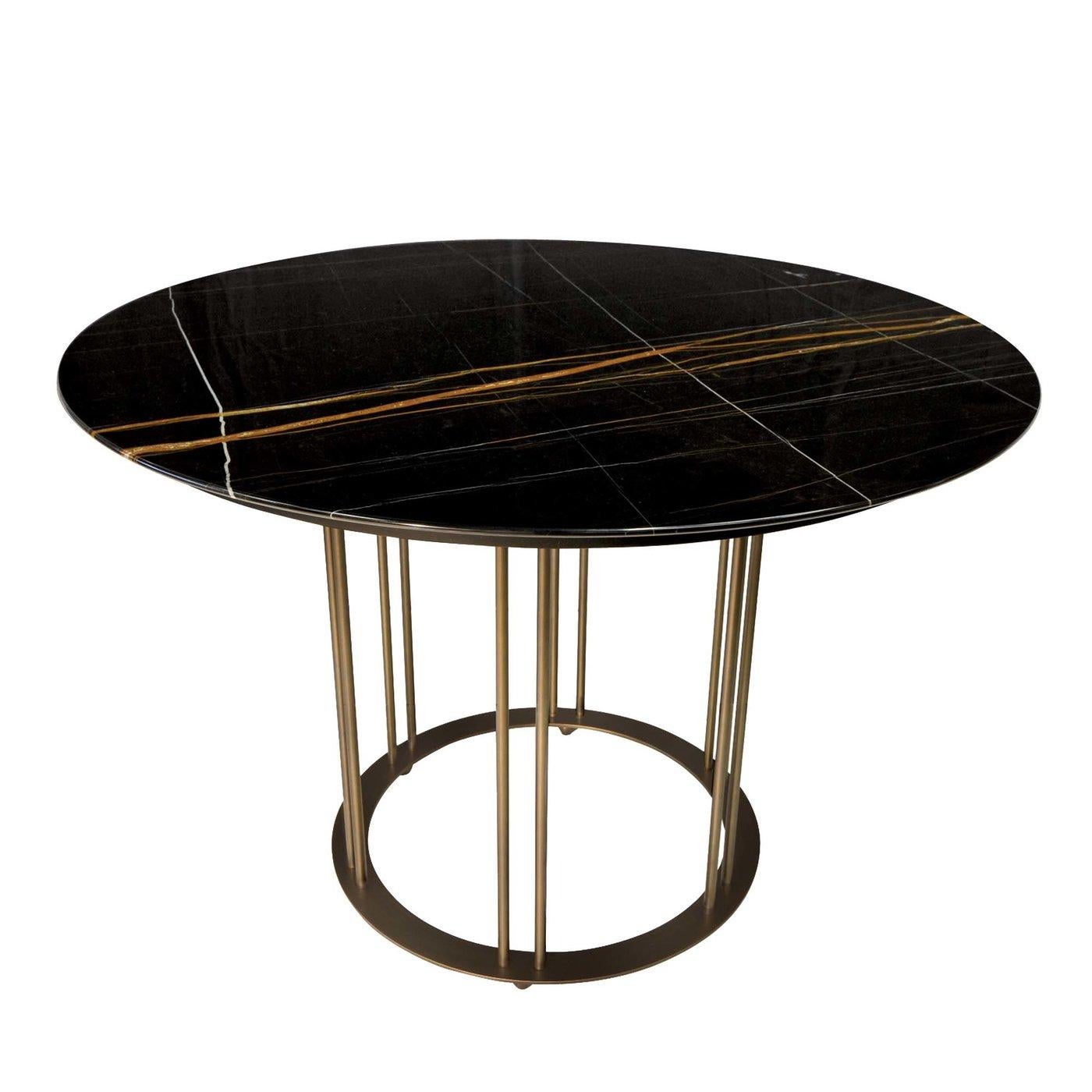 A pleasure to sit around during evening dinners or special occasions, this spectacular table captures a modern, minimalist aesthetic. The top is fashioned of Nero Guinea marble, prized for its deep black color and red, yellow, and white veining. Six