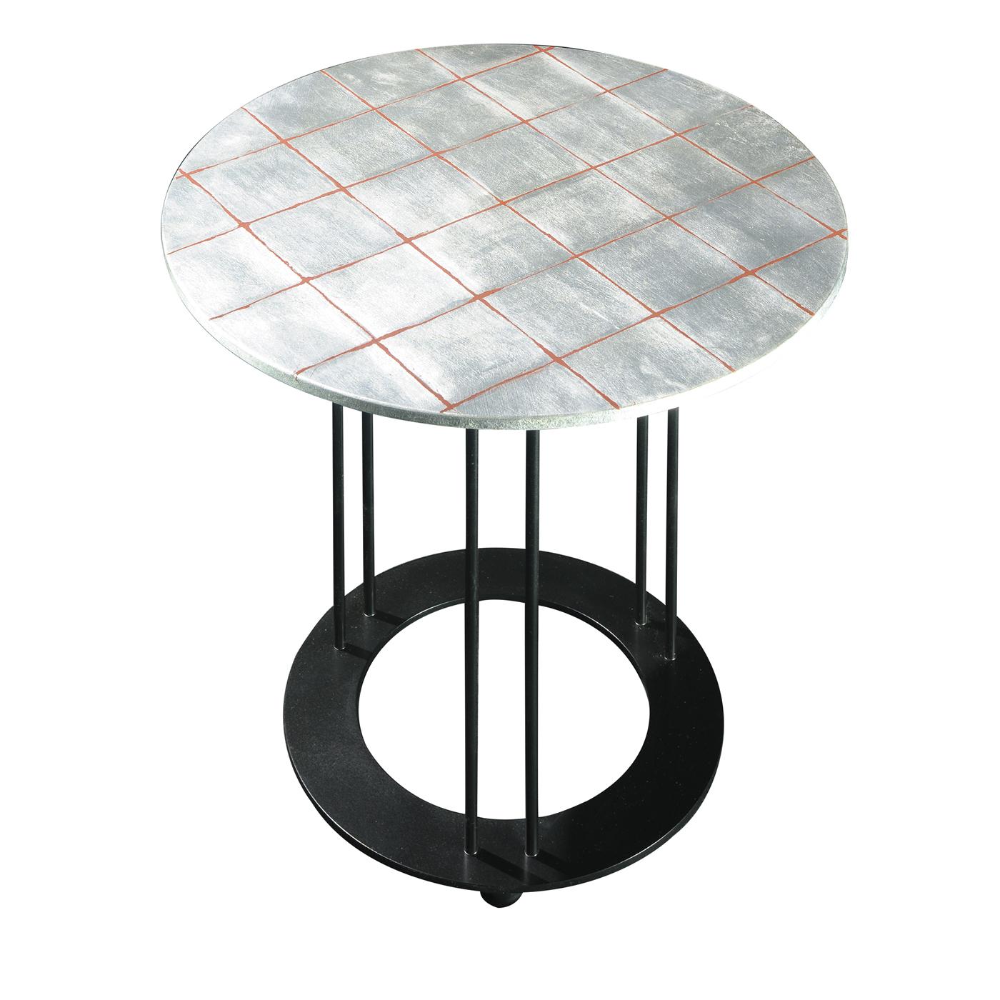 This coffee table is a unique piece of sophisticated allure exquisitely crafted with a clean, essential silhouette marked by simple geometric lines. The black coated metal structure is composed of three elongated, slim legs mounted on a base with