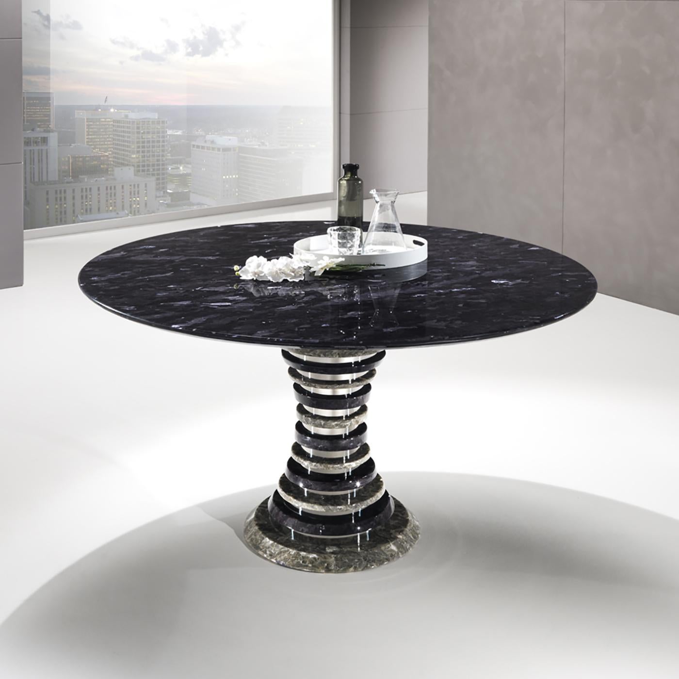 This elegant round dining table belongs to the distinctive Auriga Collection handcrafted of Crystal Stone®, a crystalline alabaster unique to the Ballarini family's exclusive quarry and sculpting atelier in the Romagna region of Italy. This table