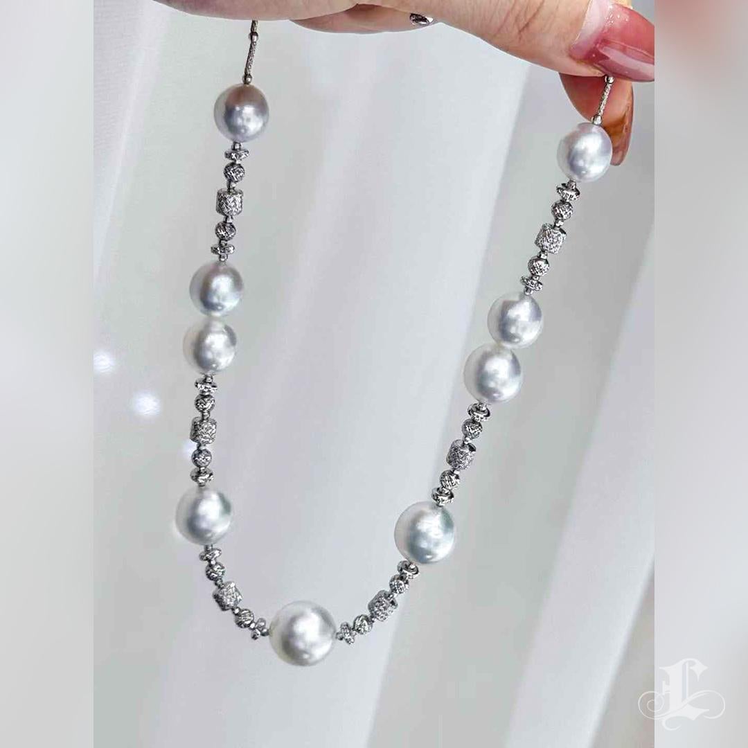 Elegant 18K White Gold Sculpted Necklace with 10-14mm Aurora South Sea Pearls For Sale 4
