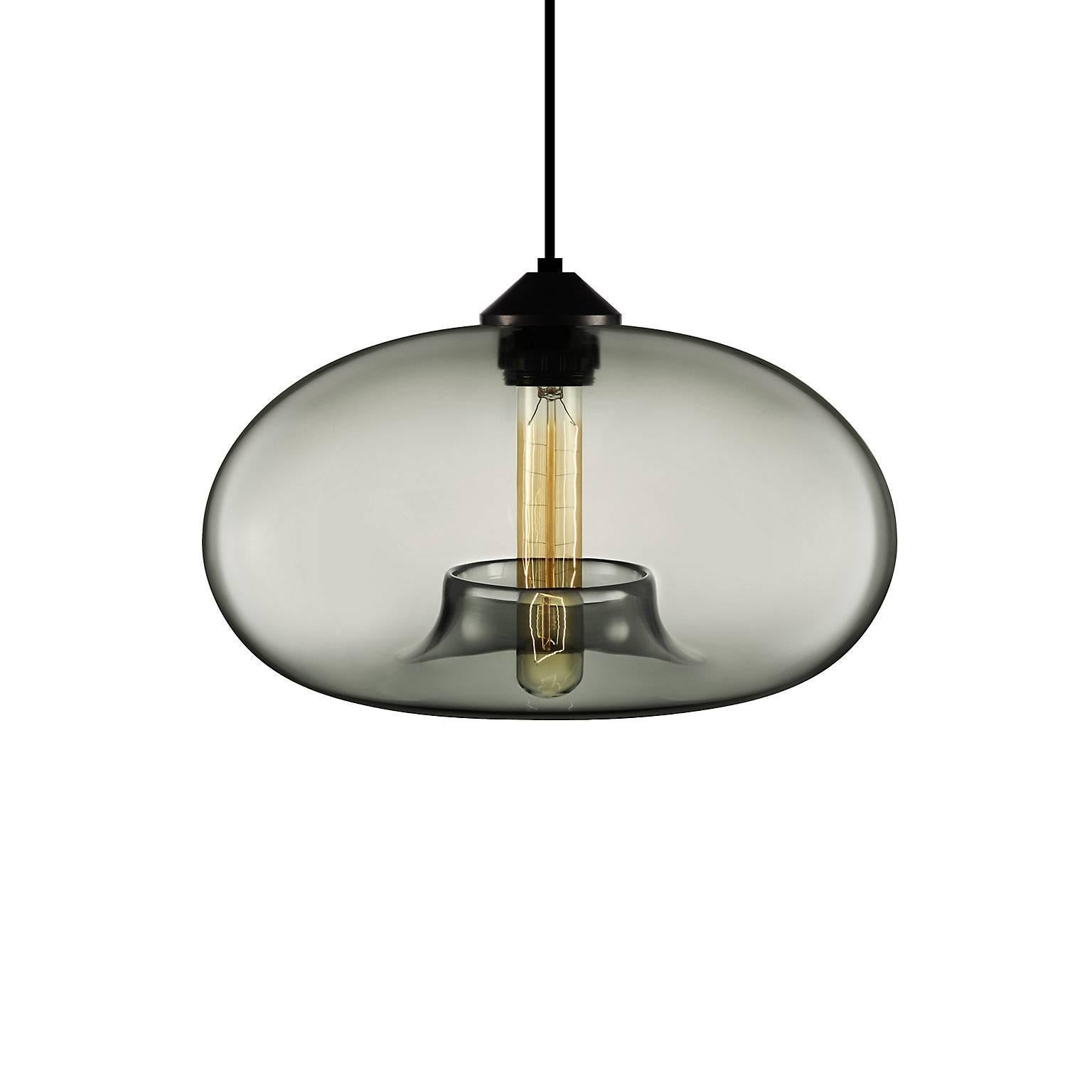Conjuring the awe of the northern lights, the Aurora pendant’s distinctive shape captures the craftsmanship and artistry of handblown glass. Every single glass pendant light that comes from Niche is handblown by real human beings in a