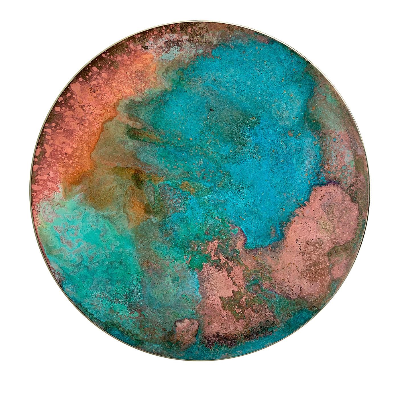 Inspired by romantic sunrises, this singular decorative disk takes advantage of the intriguing traceries and shades oxidizing liquids create. Each piece is carefully handcrafted, flaunting vibrant decoration where pink, turquoise, and mustard shades