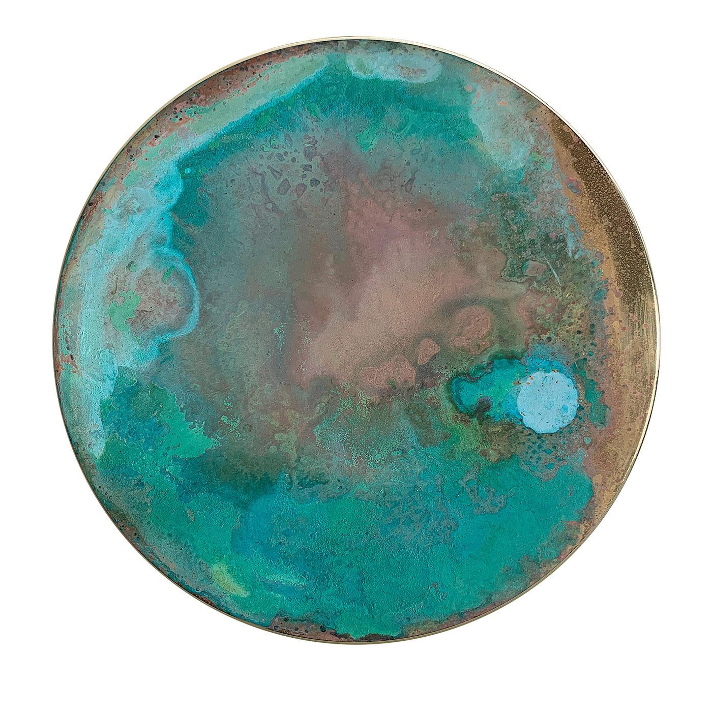 This decorative disk is handcrafted of brass and treated with oxides and acids to create mesmerizing traceries and hues belonging to the Aurora Collection. The interaction of the acids lends it its characteristic corroded look. Signed by the artist