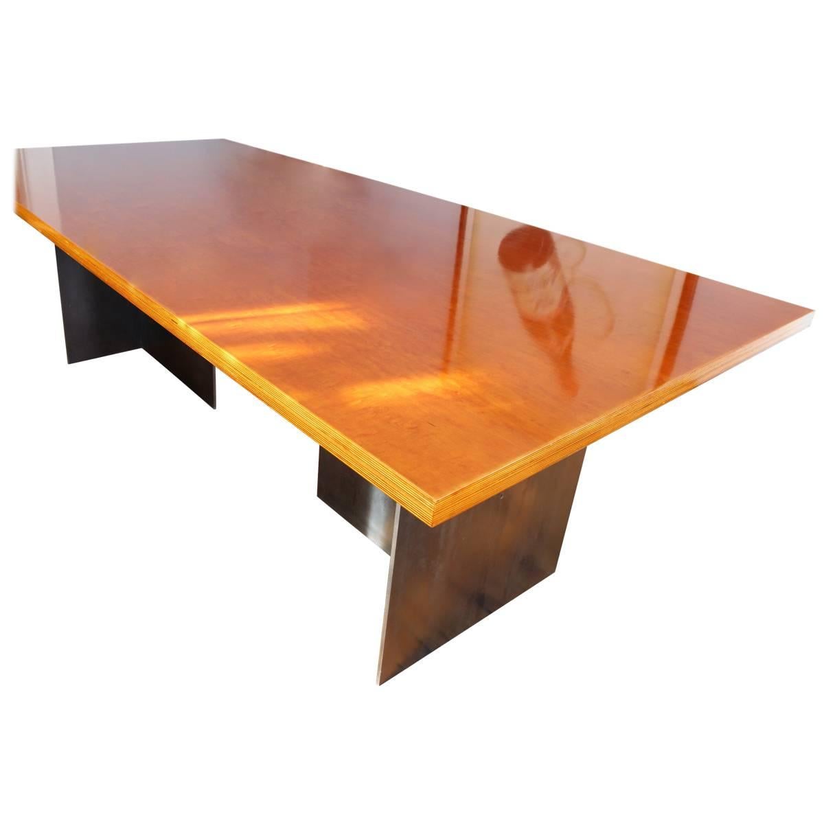 The Aurora Dining Table is a bold reinterpretation of the contemporary dining table — striking in its contrast of form and finish. A 3/8