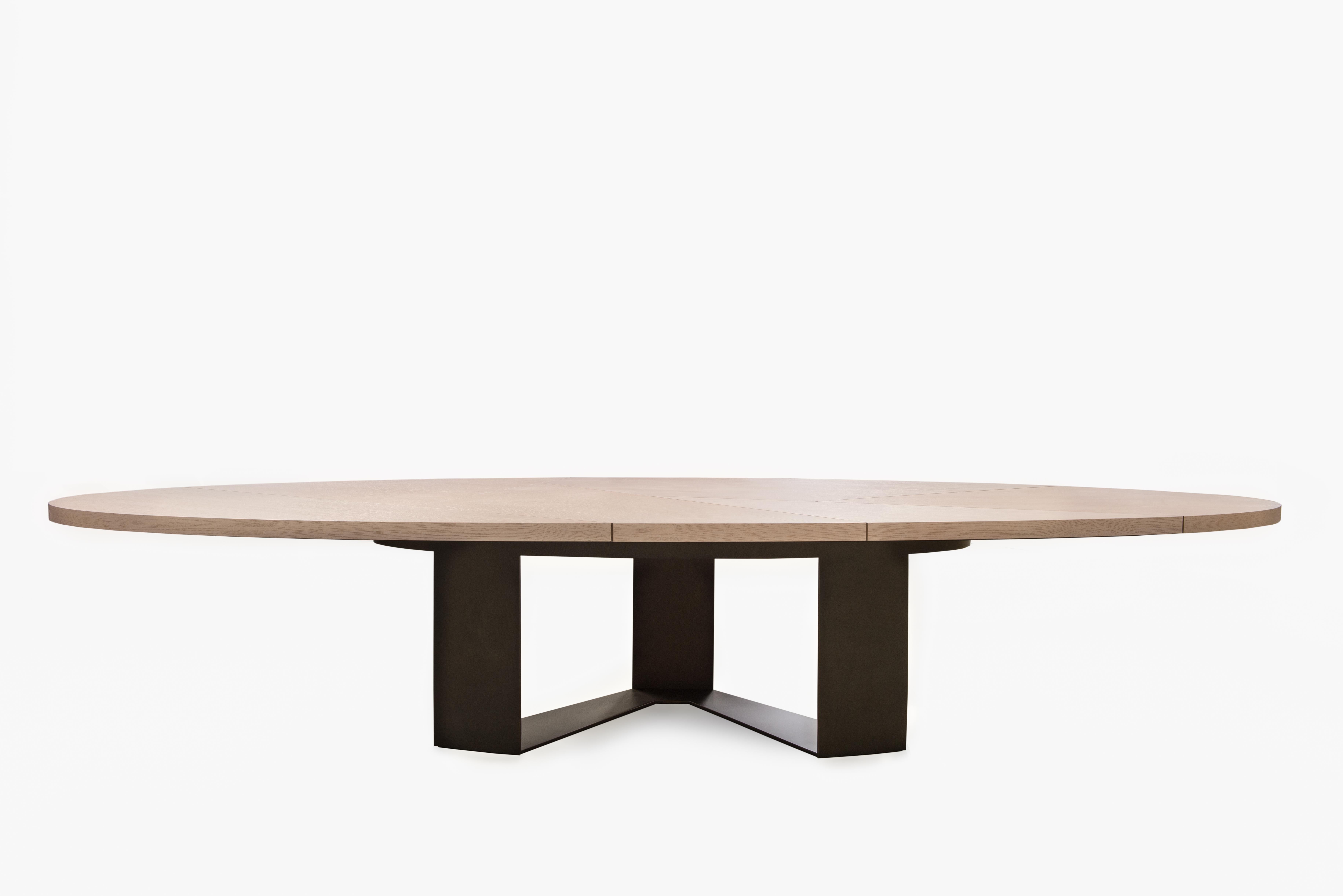 Create a casual dining setting with the Aurora Dining Table and watch it bring a sense of style and industrialism to your dining room.

The Aurora Dining Table uses the trilateral base of the Aurora Coffee Table, its predecessor. The wide timber top