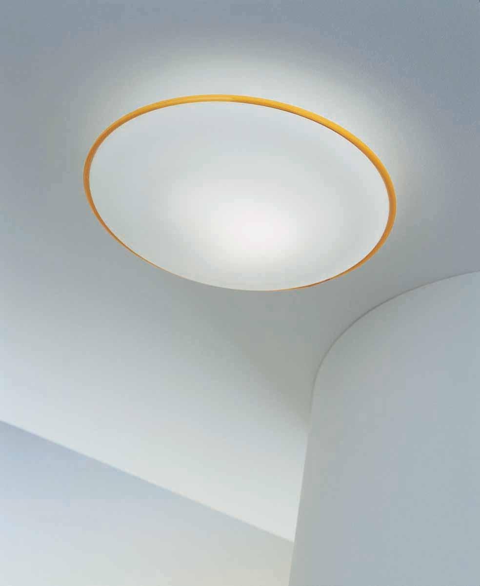A flush light that can be utilized as ceiling sconce or pendant. Close lenticular shape made of satin white glass with a topaz 