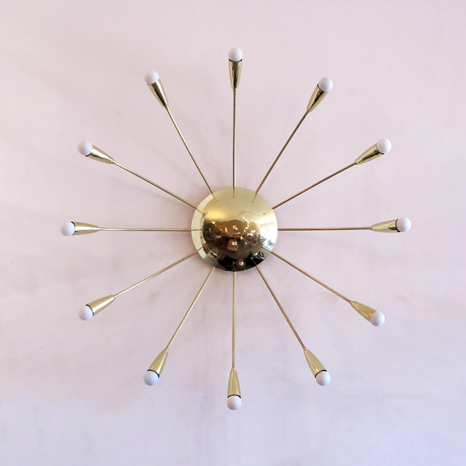 Elegant twelve light Aurora wall or ceiling light designed by Gallery L7, handcrafted and finished in Los Angeles from American brass. Twelve E12 sockets per fixture, max. wattage 25w each, wired for US standards or European standards (110v/220v),