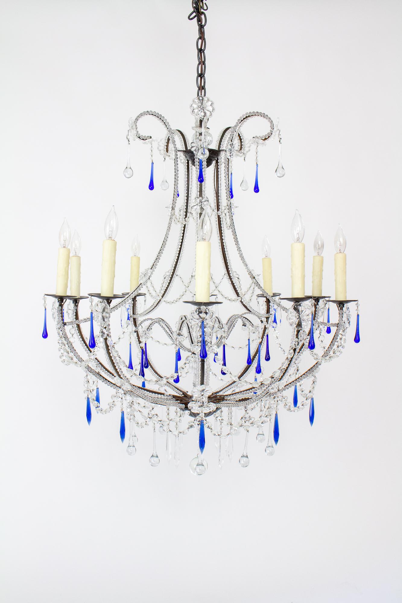 Aurora Grande large iron and crystal chandelier. Inspired by the simple elegance of French Art Deco crystal chandeliers, this is a custom piece designed by Loukas and made in our own workshop. Hand crafted iron frame, strung with crystals. Shown