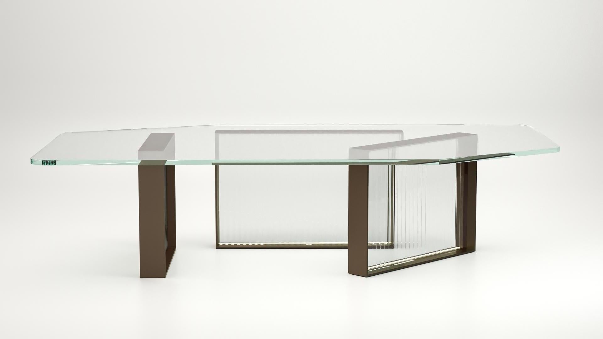 The Aurora III tables are statement pieces, demanding attention in any living space it inhabits. The ribbed cast glass base is available in smoke or amber glass and it is topped with an asymmetrical glass top. The Aurora tables exemplify Lauren