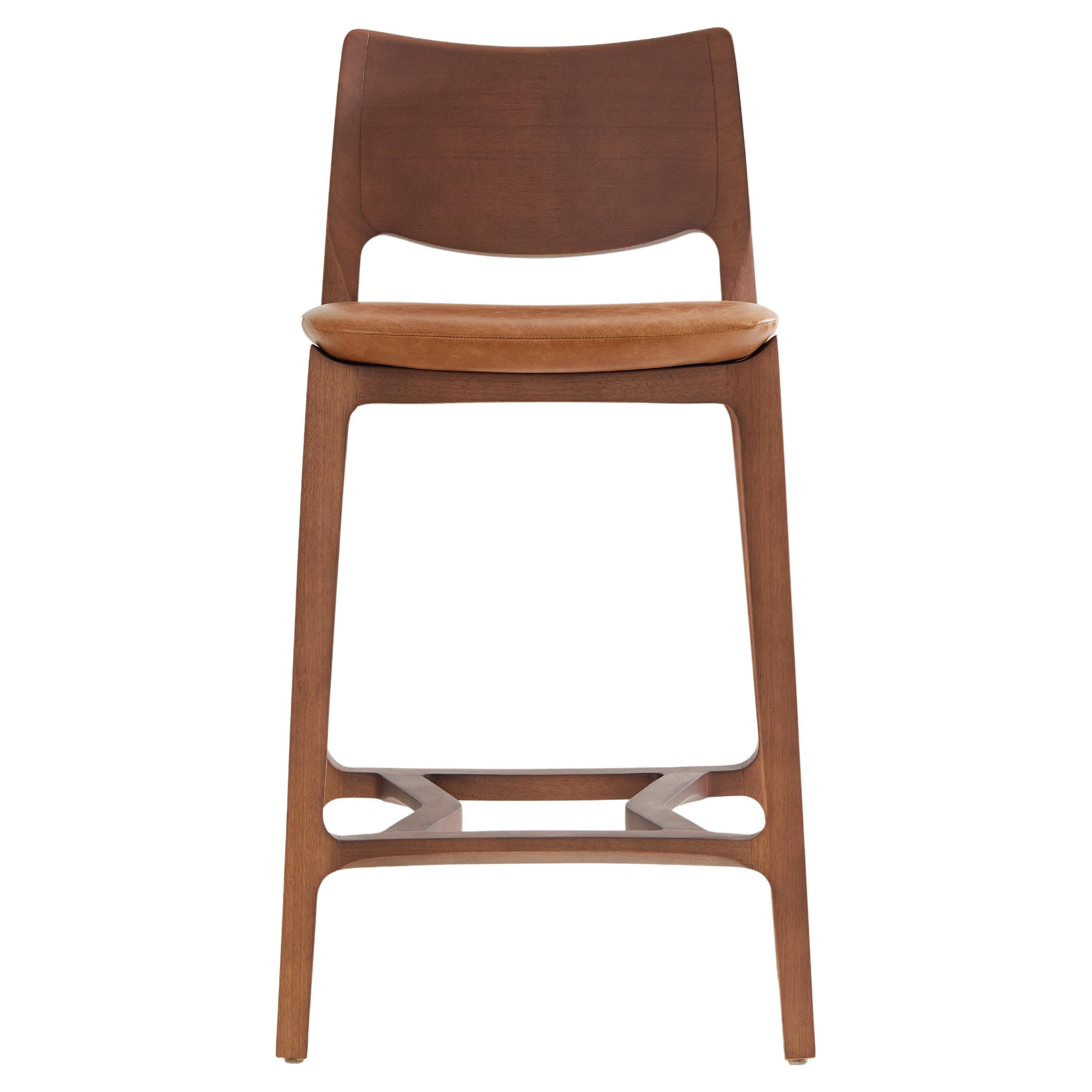 Aurora stool, walnut solid wood finish, solid back, camel leather seating For Sale