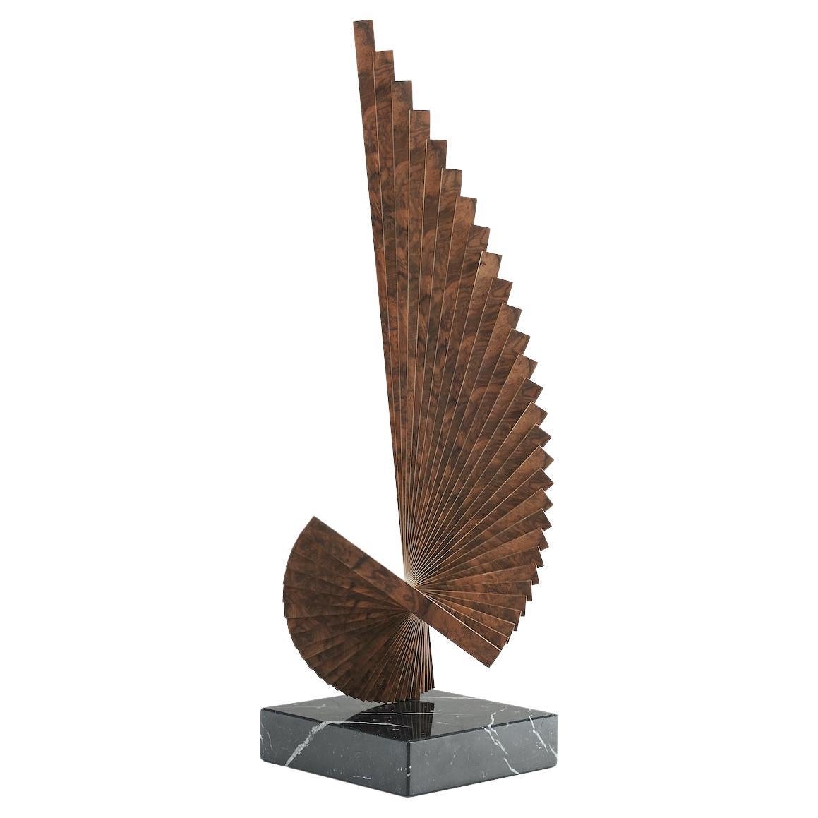 Tabletop sculpture constructed from flitches of book-matched walnut and brass