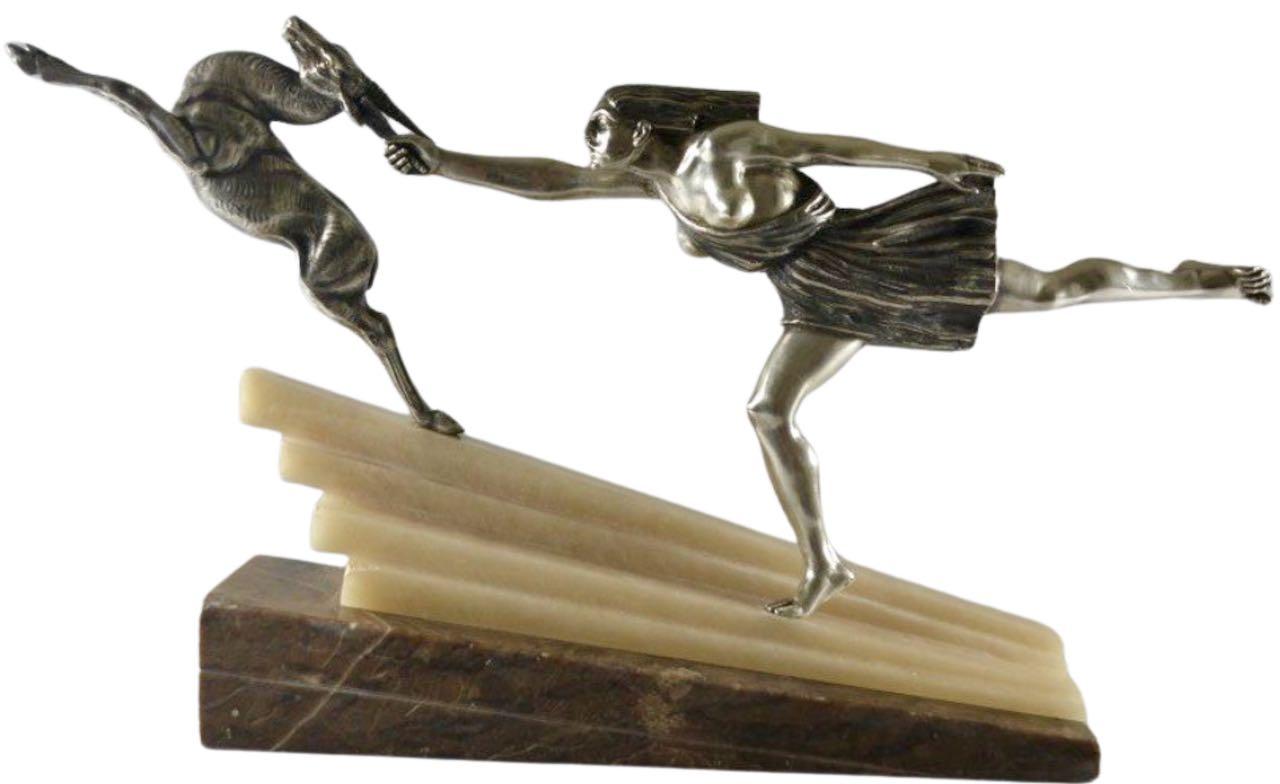 Silvered Bronze Art Deco Statue Pair featuring a woman reaching and grasping the antlers of a deer, a rare version of “Chasing the Hind” Designed by Aurore Onu French circa 1930. It has an outstanding classic and cubist design, with a female figure