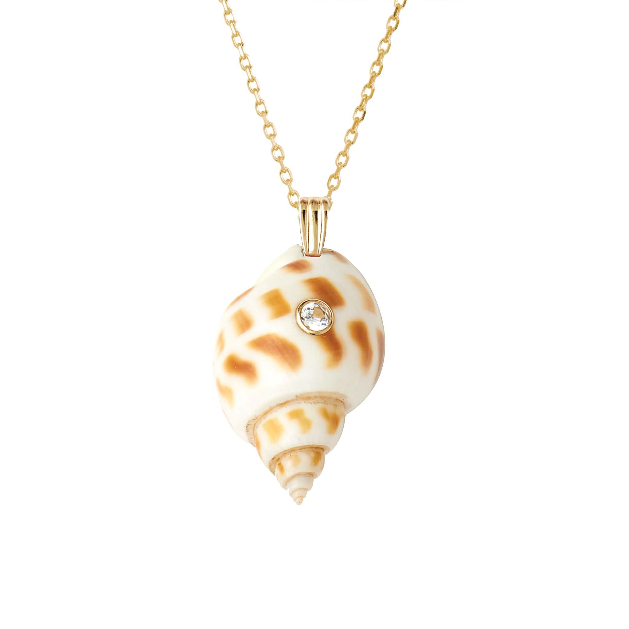 Natural shell pendant with solid 14k gold findings and natural white sapphire gemstone. Wear this pendant alone or layer it with other gold chains for a beautiful layered effect.  

Order includes one shell pendant, exactly as depicted in primary