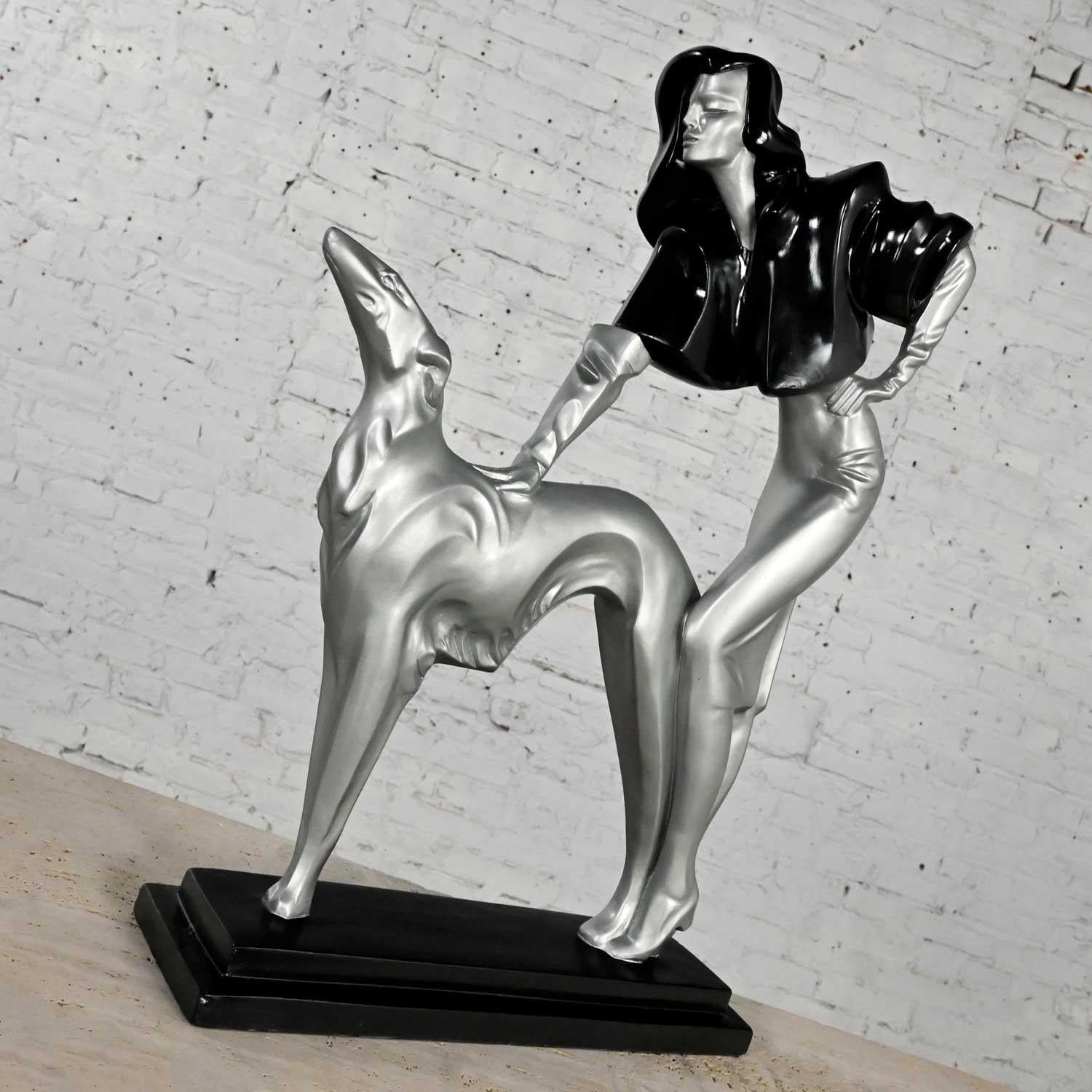Fabulous Art Deco Revival statue “Afternoon Stroll” lady and borzoi dog by Alexsander Danel for Austin Productions comprised of Durastone which is a copyrighted material of Austin Productions. Beautiful condition, keeping in mind that this is