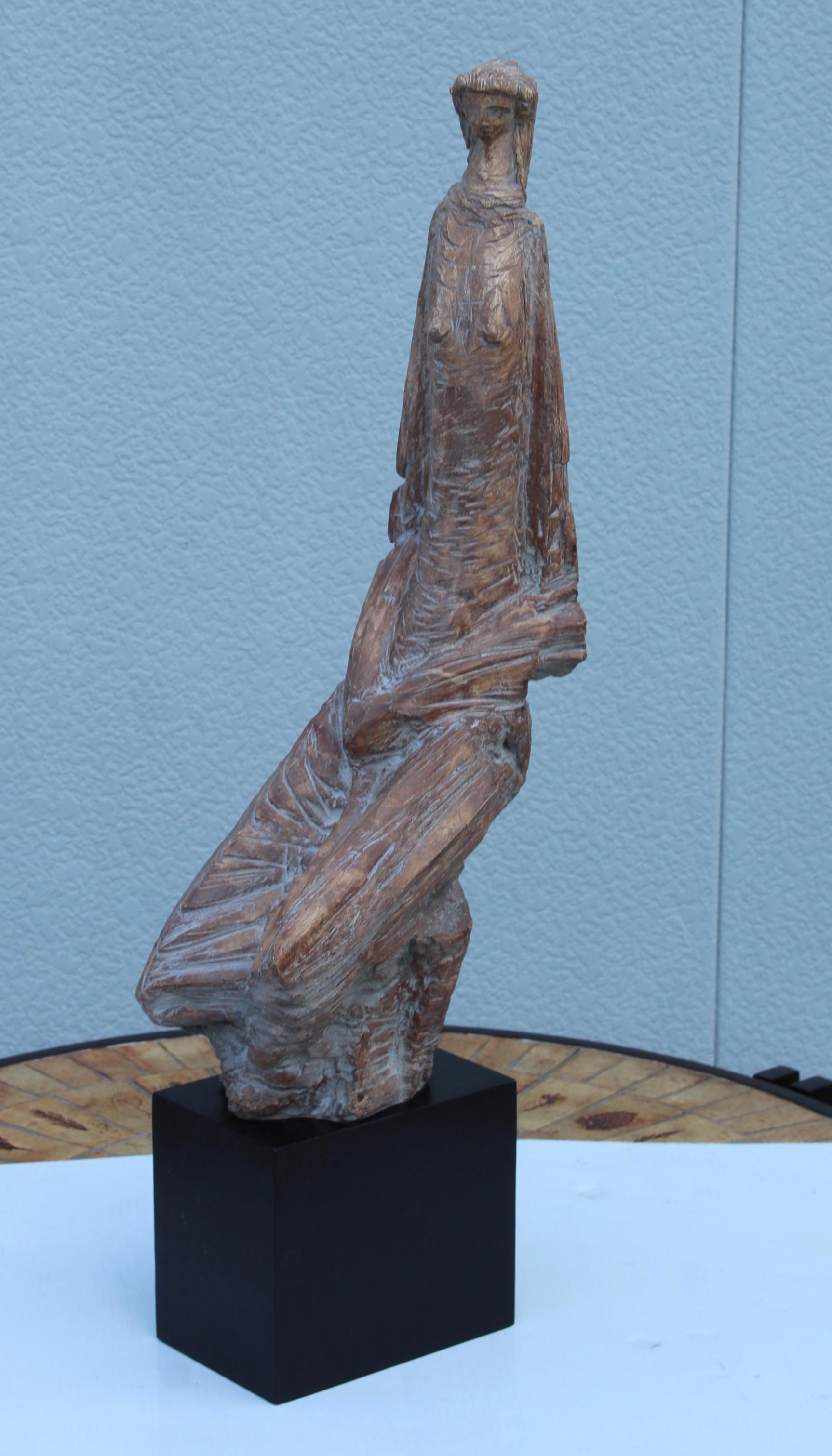 1970's large abstract sculpture of a kneeling woman signed and dated made by Austin Productions, in vintage original condition with minor wear and patina due to age and use.