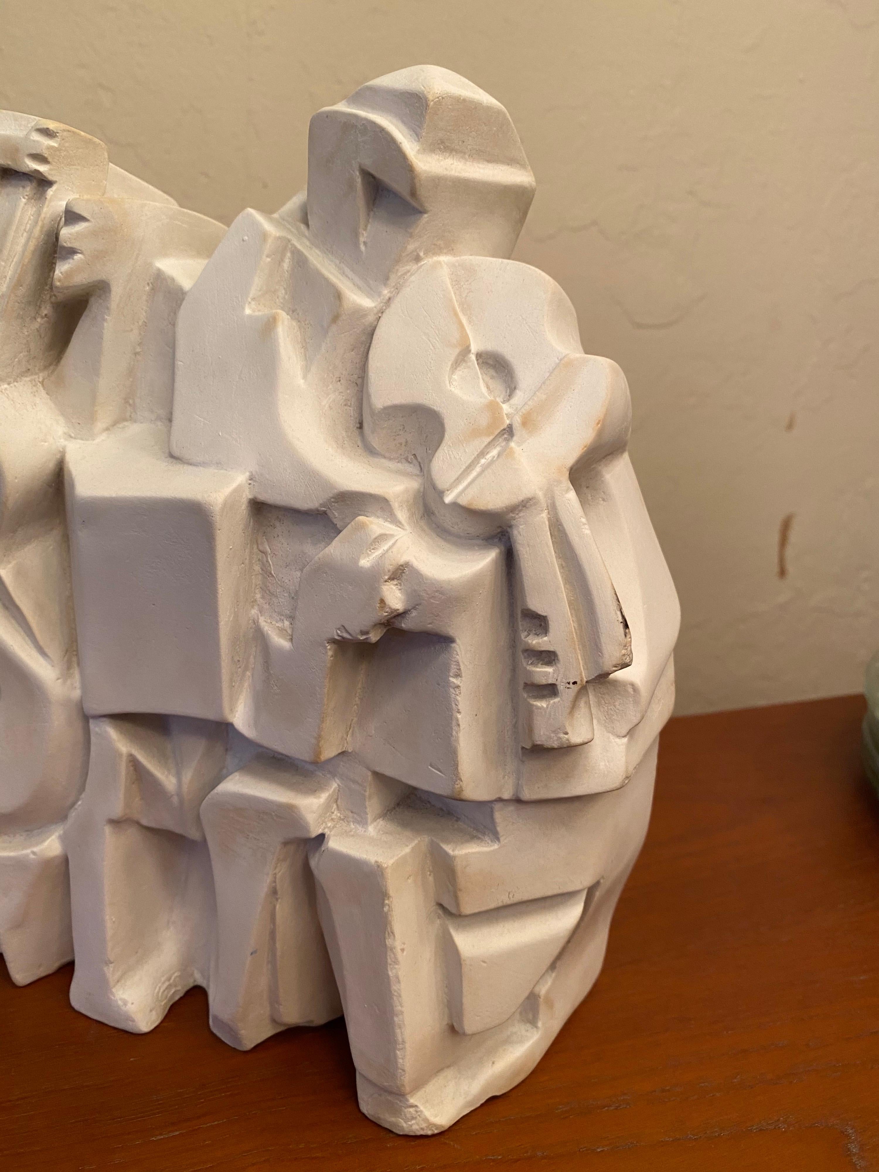 Austin productions did some great decorative cast plaster pieces over their time in business, this might be one of their best! Cubist musicians in an original white finish.