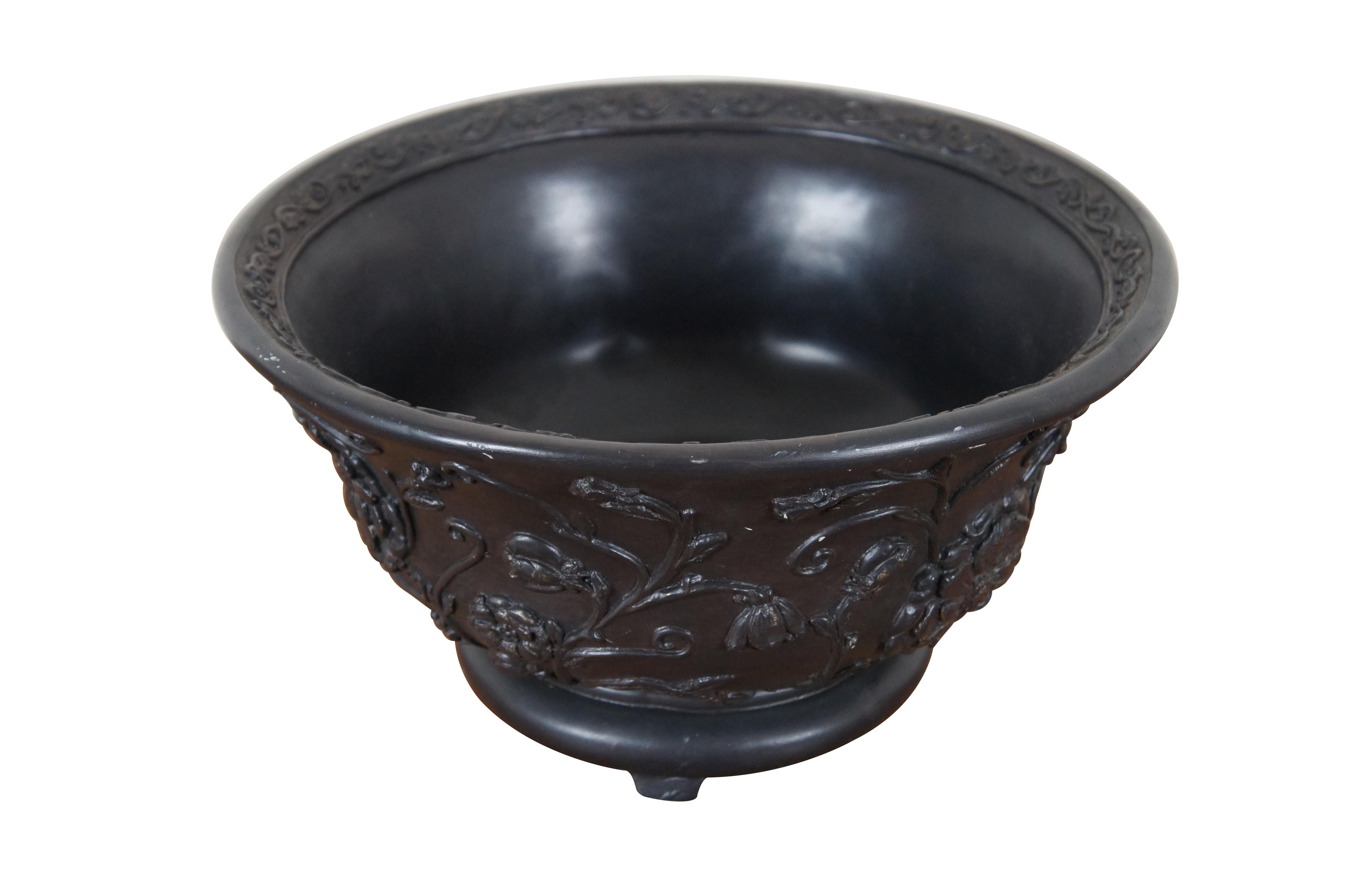 A rare Austin Productions Centerpiece, Jardinière or Bowl.  Features a black finish with low relief floral and chrysanthemum design.  The bowl is signified by a flared mouth with detailed rim and chrysanthemum at the center of the base.  The pot has