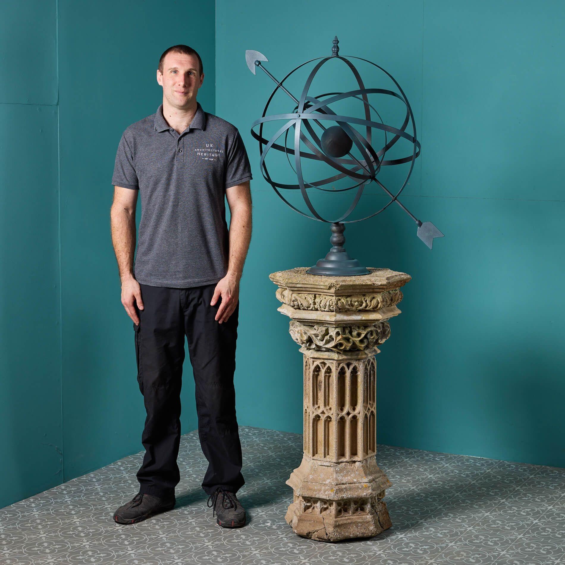 A striking focal point for any garden, this impressive sundial pairs a mid 19th century gothic style stone pedestal by Austin and Seeley (unsigned) circa 1840, with a 20th century steel armillary sphere.

Coupling composition stone intricacy with a