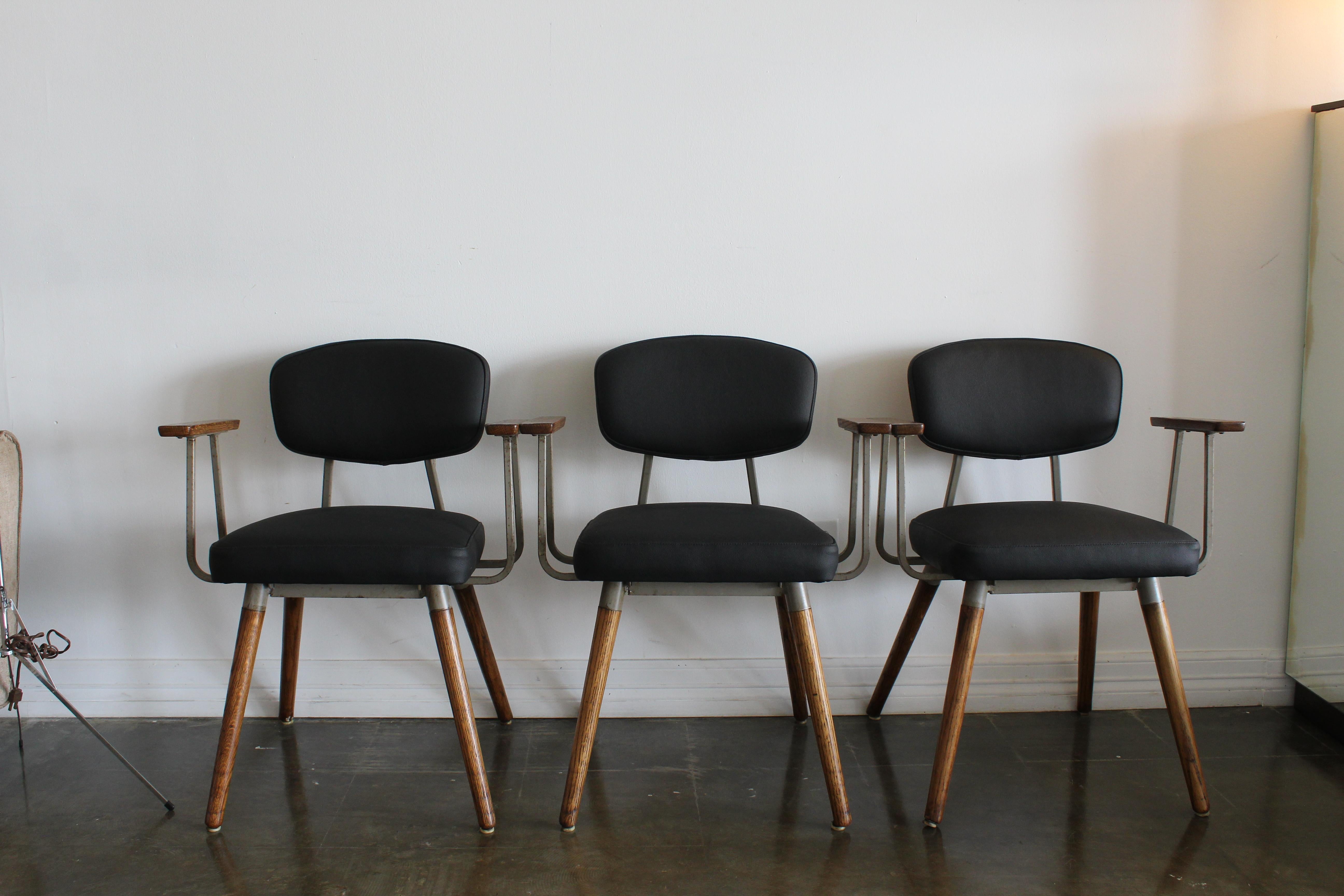 These lovely set of chairs once belonging to the college campus of University of Texas. recently upholstered in black leather these are perfect for desk chairs or dining chairs.