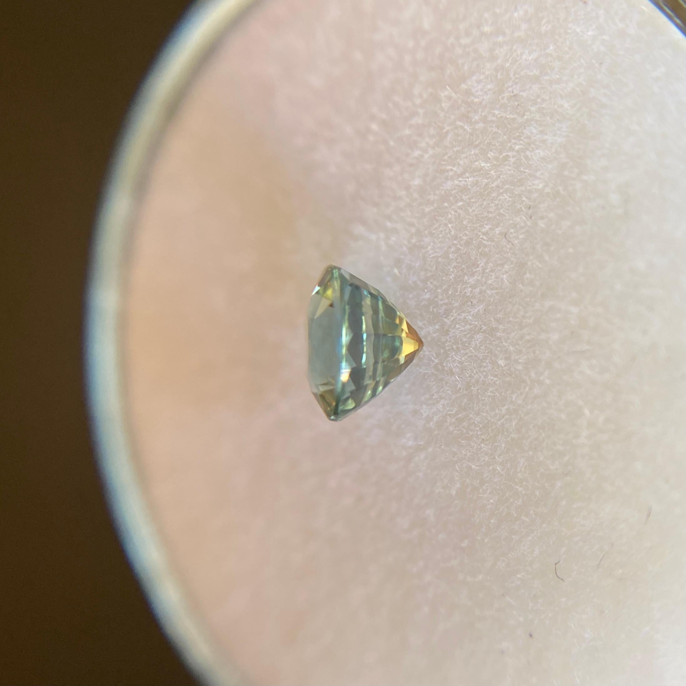 Fine Natural Australian Blue Green Sapphire Gemstone.

0.66 Carat with a beautiful and unique blue green colour and very good clarity, clean stone with only some small natural inclusions visible when looking closely.

Also has an excellent round cut