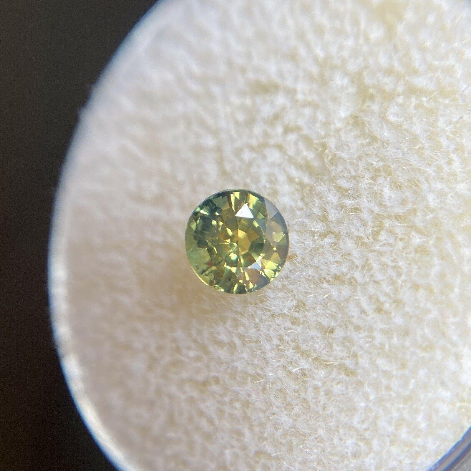 Australian 0.73ct Untreated Yellow Green Parti Colour Sapphire Round Cut 4.8mm

Natural Parti Colour - Green Yellow Blue Australian Sapphire Gemstone. 
0.73 Carat with a beautiful and unique yellowish green blue colour and excellent clarity, a very