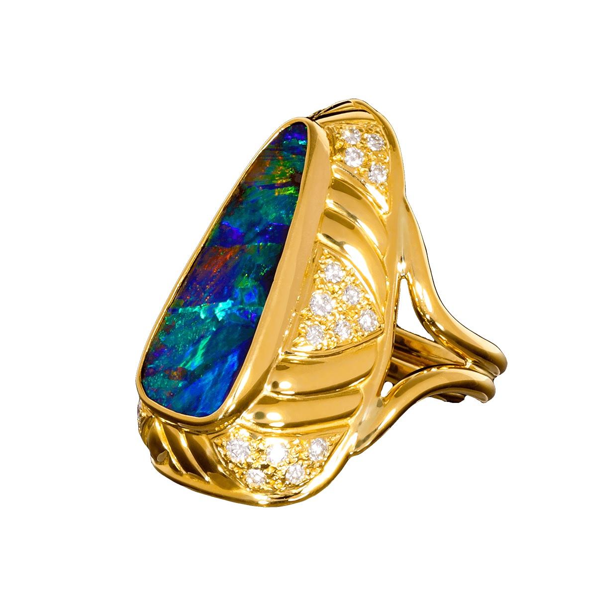 This amazing boulder opal is the best gem opal we have ever had in a ring. It has outstanding clarity with crisp sharp colours and patterns without equal.

The block harlequin pattern is overlaid with a broad flash and chaff patterns in truly