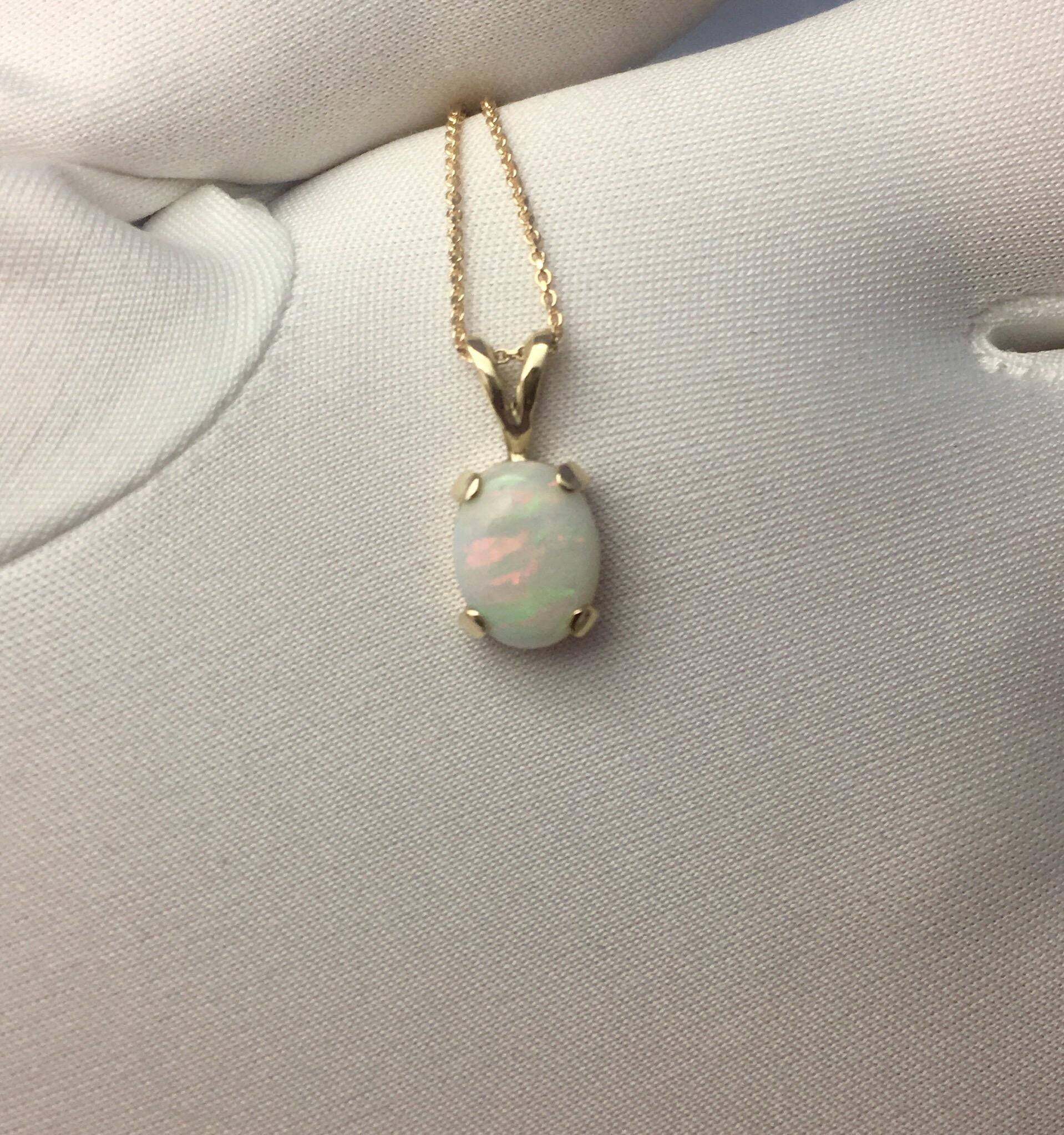 Beautiful fine Cooper Pedy white opal with stunning play of colour.
Set in a fine 14k yellow gold solitaire pendant.

Stunning Australian opal with an excellent polish and lots of colour flash. Blues, greens, oranges, yellow, purple, reds... this
