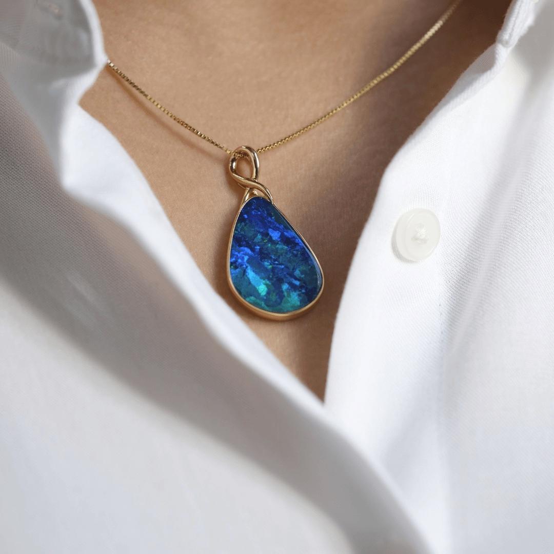 Charming and expressive is the wearer of the 'Angel of Mine' opal pendant, featuring an exquisite opal doublet (11.19ct) sourced from Coober Pedy opal mines. Set in our elegant 18 karat yellow gold, this opal pendant presents deep hues of blue and