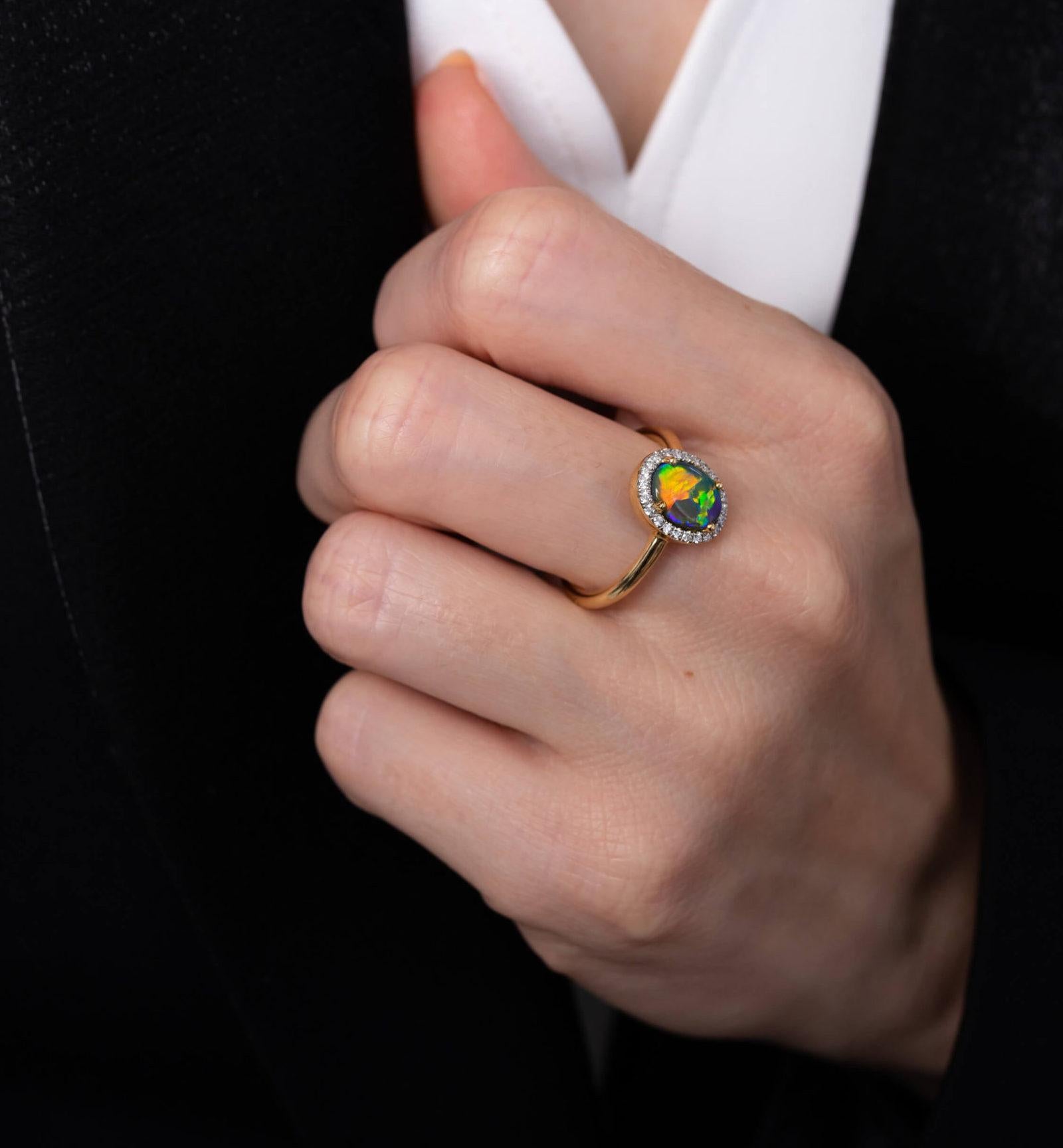 “Giovanna” opal ring presents a splendidly colourful black opal (1.29ct) from Lightning Ridge complemented by 23 glittering diamonds. This timeless and elegant piece makes the perfect engagement ring. The consummate expression of love; designed for