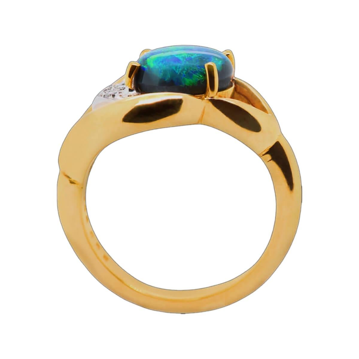 Blue-green black opals are all the rage, and this one will not disappoint. It is a very bright stone and fits perfectly with the bespoke 18K solid gold and platinum ring with brilliant white diamonds. A high cabochon stone that shows colours from