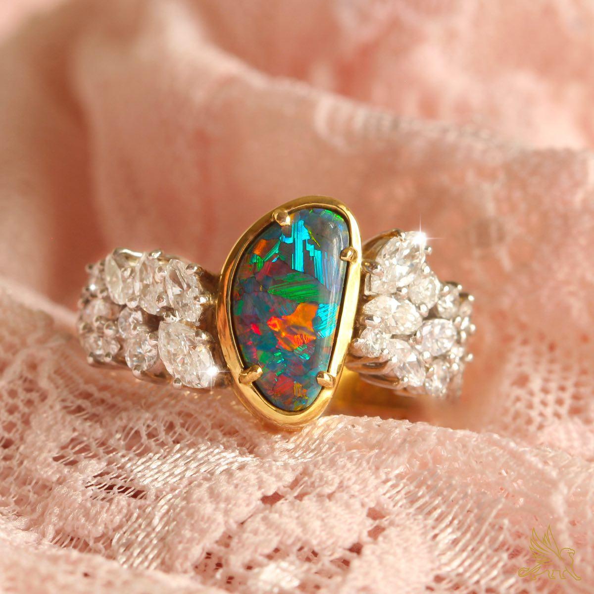 When words are not enough, this ring says it all. Such an amazingly beautiful Solid Black Opal set in 18K gold and with over 1.2ct of high jewellery grade brilliant white diamonds, this is a ring fit for a Princess. The rare pattern and vivid