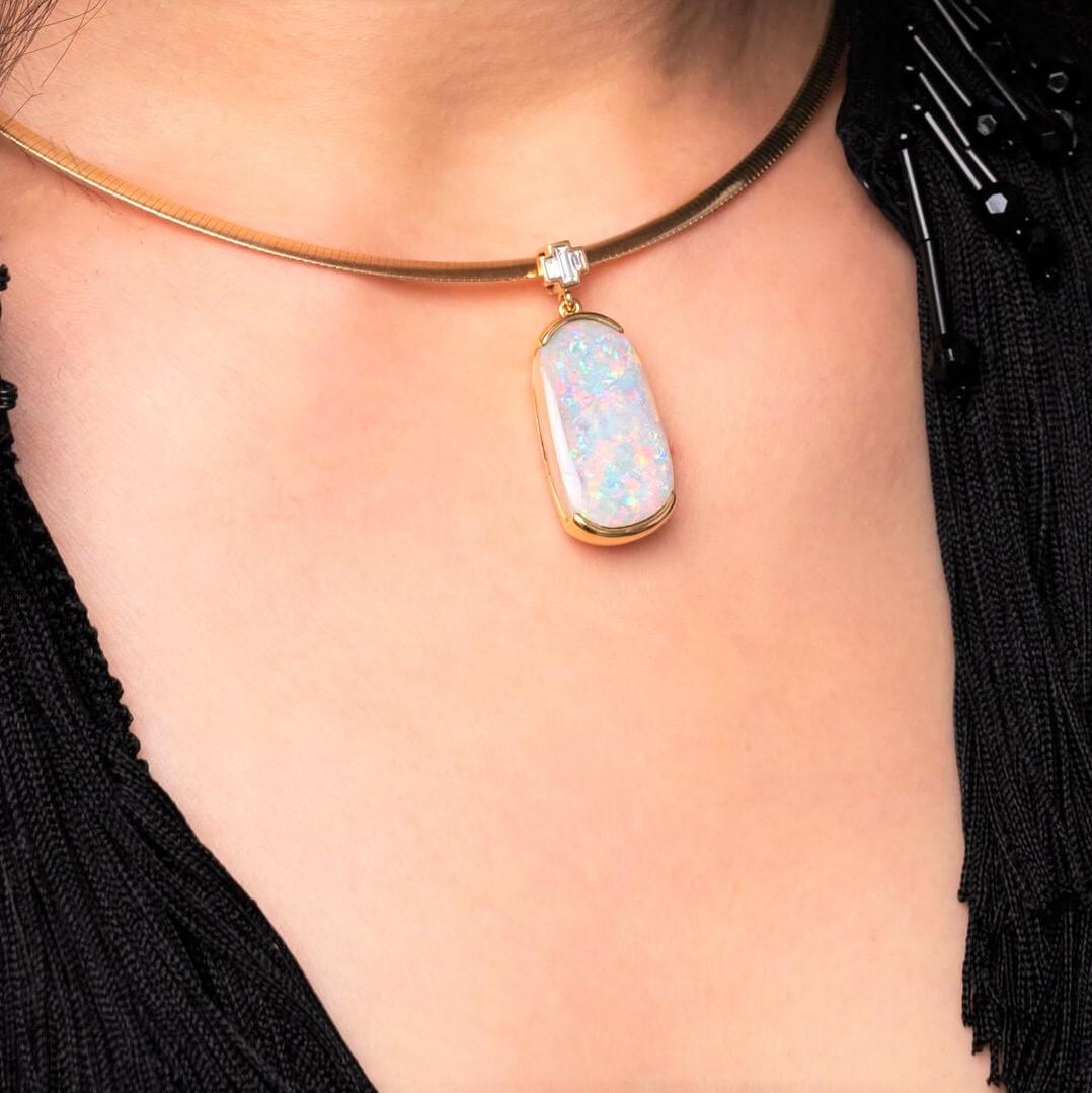 “Strictly Ballroom” opal pendant is a subdued take on an Australian cinema classic.  A splendid boulder opal (15.82ct) from our own mines in Jundah-Opalville is paired up with baguette diamonds and set in 18K yellow gold. Complete it with the