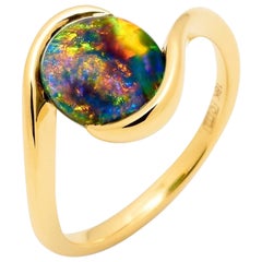 Australian 1.69ct Black Opal Ring in 18K Yellow Gold Australian 1.69ct Black Opal Ring in 18K Yellow Gold