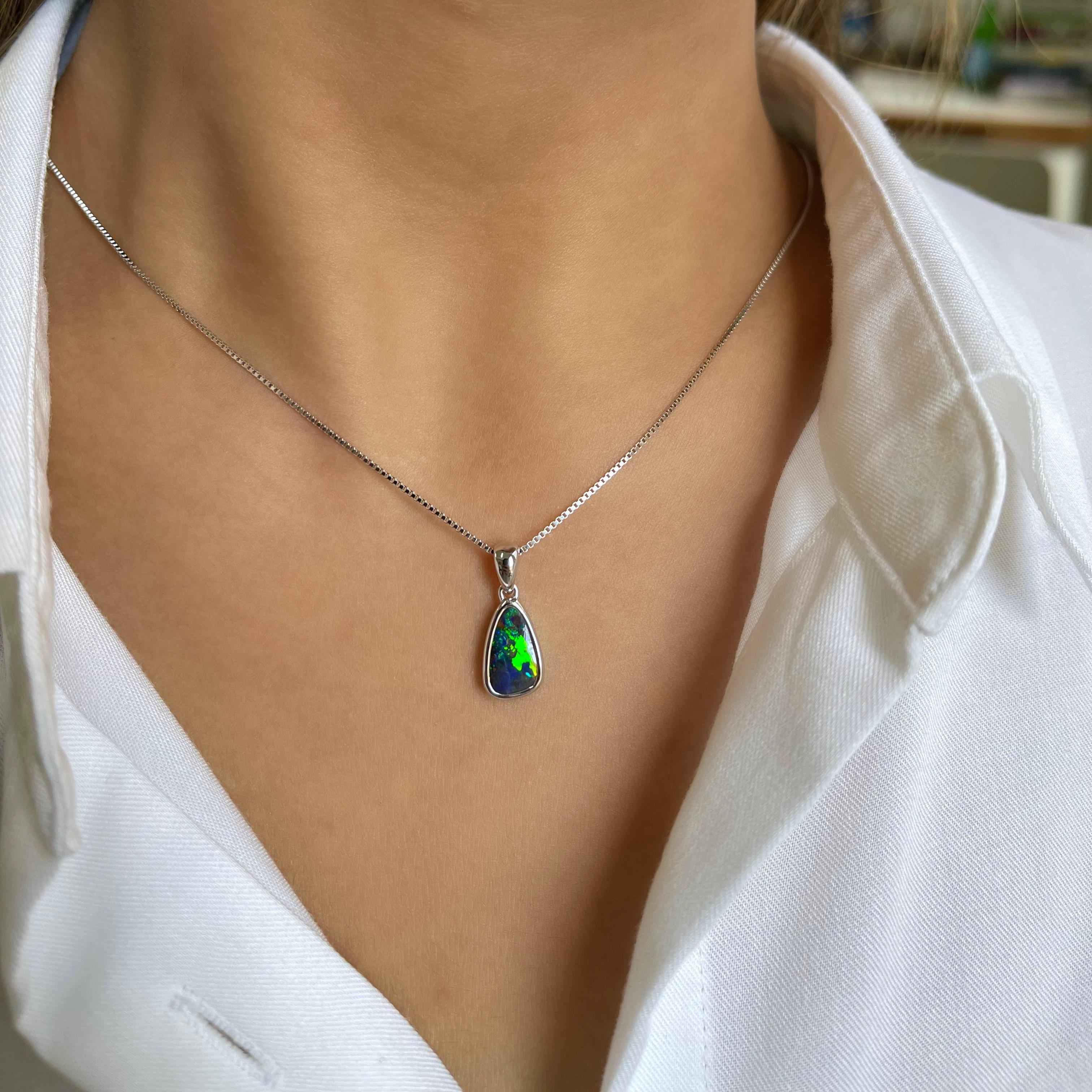 Simple yet stunning, the ‘Evanah’ opal pendant features a vivid green play-of-colour boulder opal (1.86ct) ethically sourced from Winton, Australia. Masterfully set in our classic 18 karats white gold with its minimalistic design. A perfect opal