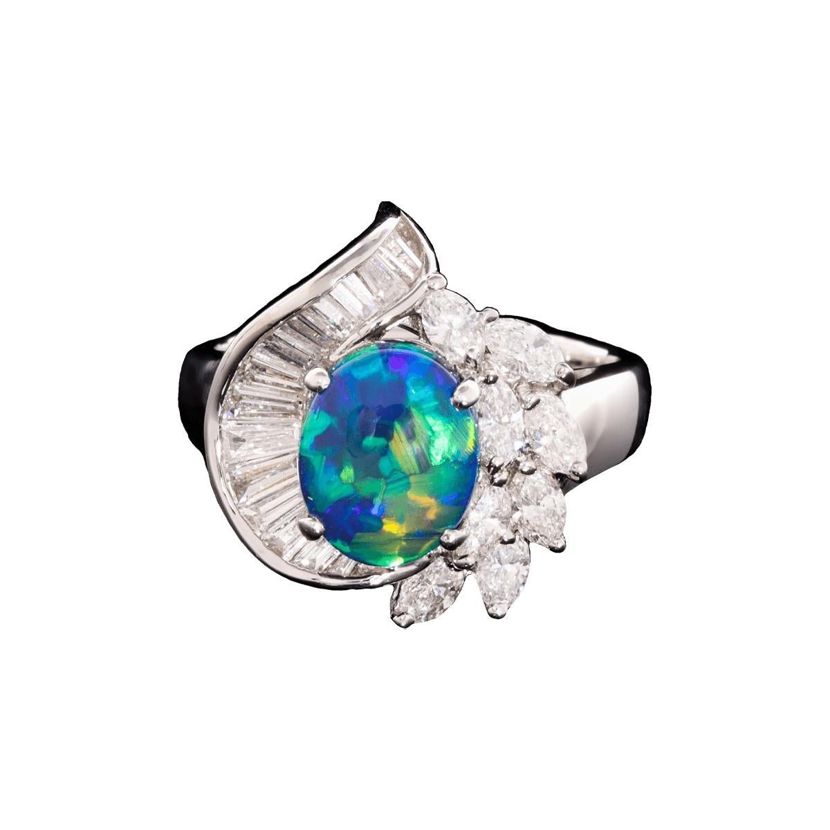 High cabochon Black Opal is already seldom found, but one with such rich colours and pattern is on another level. Then we surrounded it in almost 1.50ct of beautiful brilliant white diamonds.

Undoubtedly, this ring will be admired by all who see