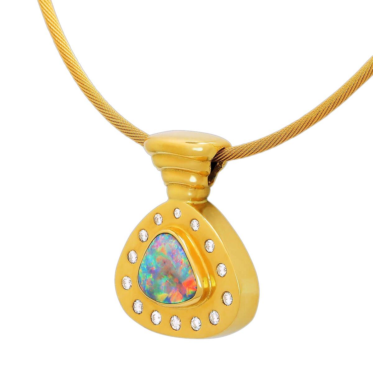 The bright opal in this piece is simply stunning. Surrounded by high jewellery grade diamonds and set in solid 18K yellow gold, it makes the opal pop with all its colourful glory. The cable chain is also solid 18K gold and the perfect accompaniment