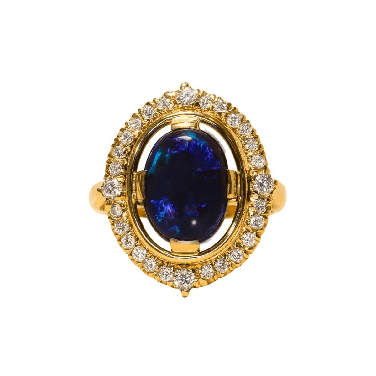 The deep blues shimmer in this Australian Black Opal like glowing flashes of an evening ocean. The brilliant white diamonds sparkle in the light, reflecting in the high polish of the opal like stars meeting the ocean's horizon on a clear romantic