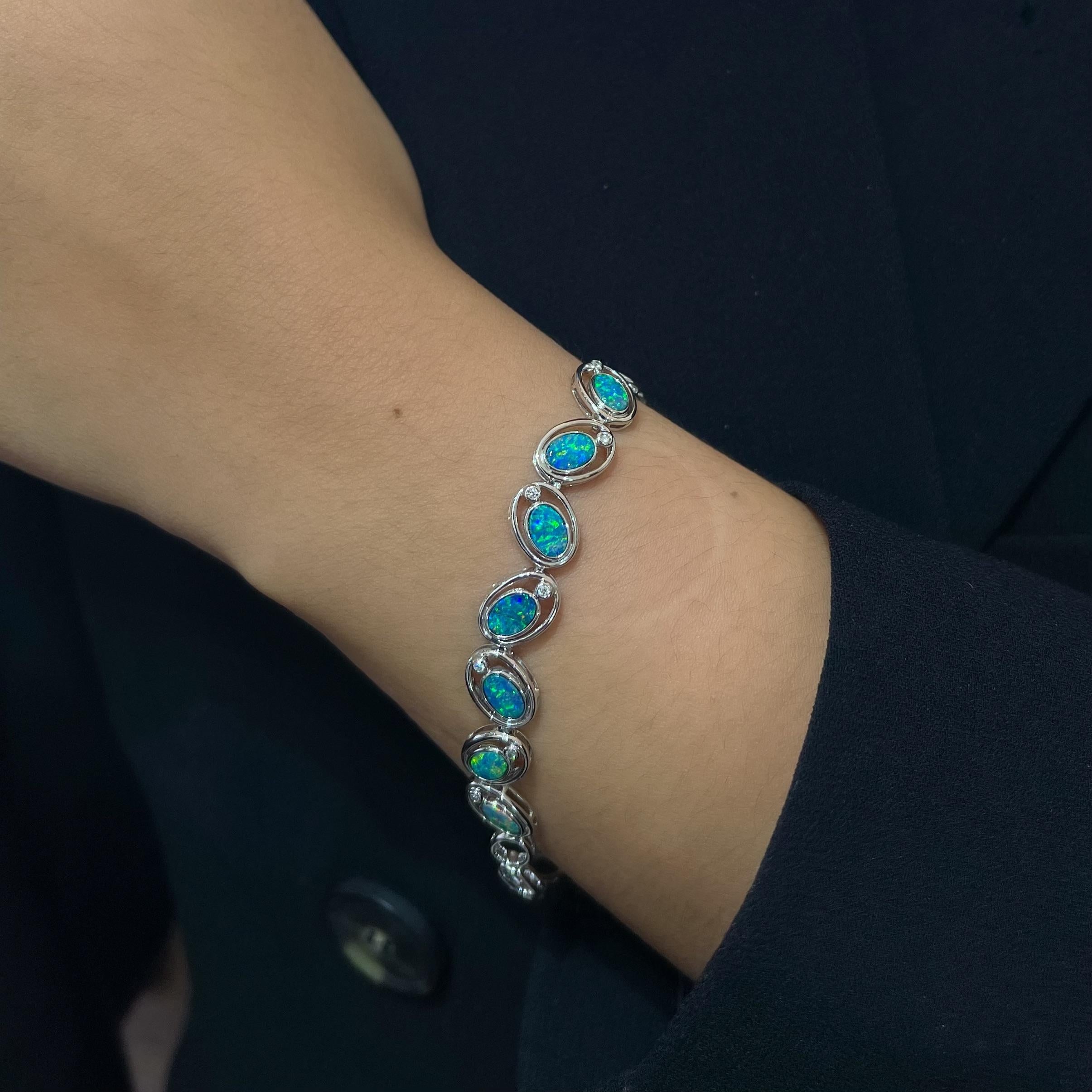 Playful and curious is the wearer of ‘Playful Josie’ bracelet featuring seven enticing opal doublets (2.7ct) set in gorgeous 18K white gold with shining diamonds to complement the electrifying and graceful blue-green play-of-colour of the gemstones.